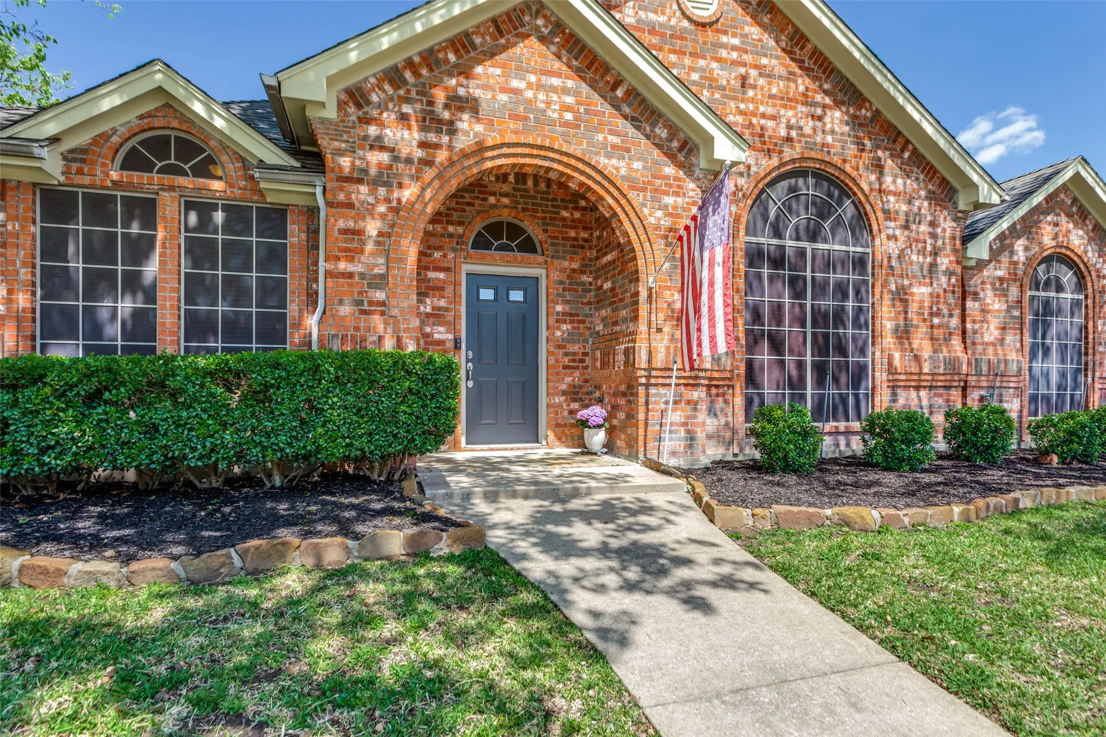 Inviting front door to this well maintained home with solar screens for energy efficiency!