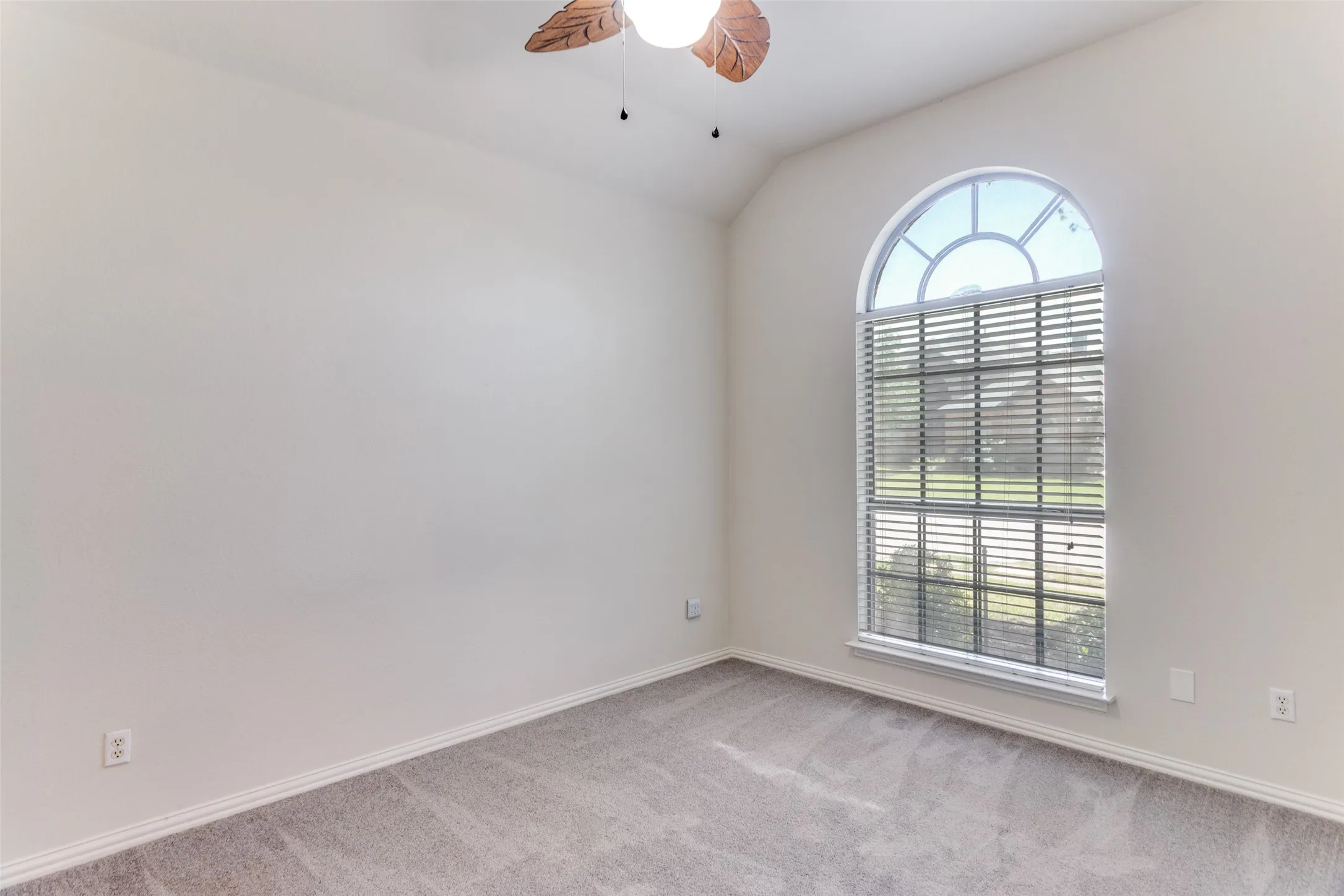 Bedroom #3 ceiling fan, vaulted ceiling, large closet and light colored carpet