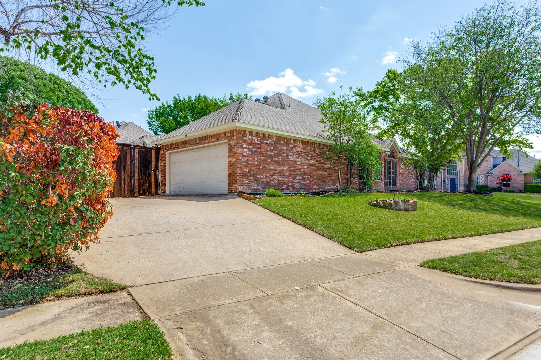 View of side steet with drive way, 2 car garage, and plenty of parking.