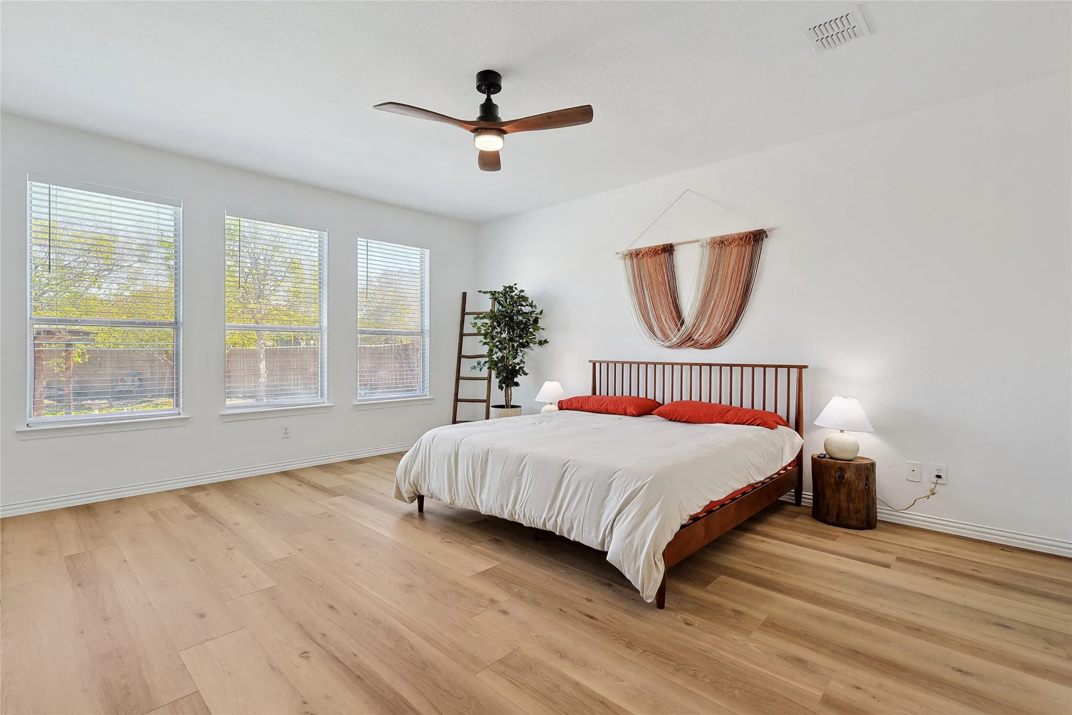 Bedroom with wood-type flooring and ceiling fan