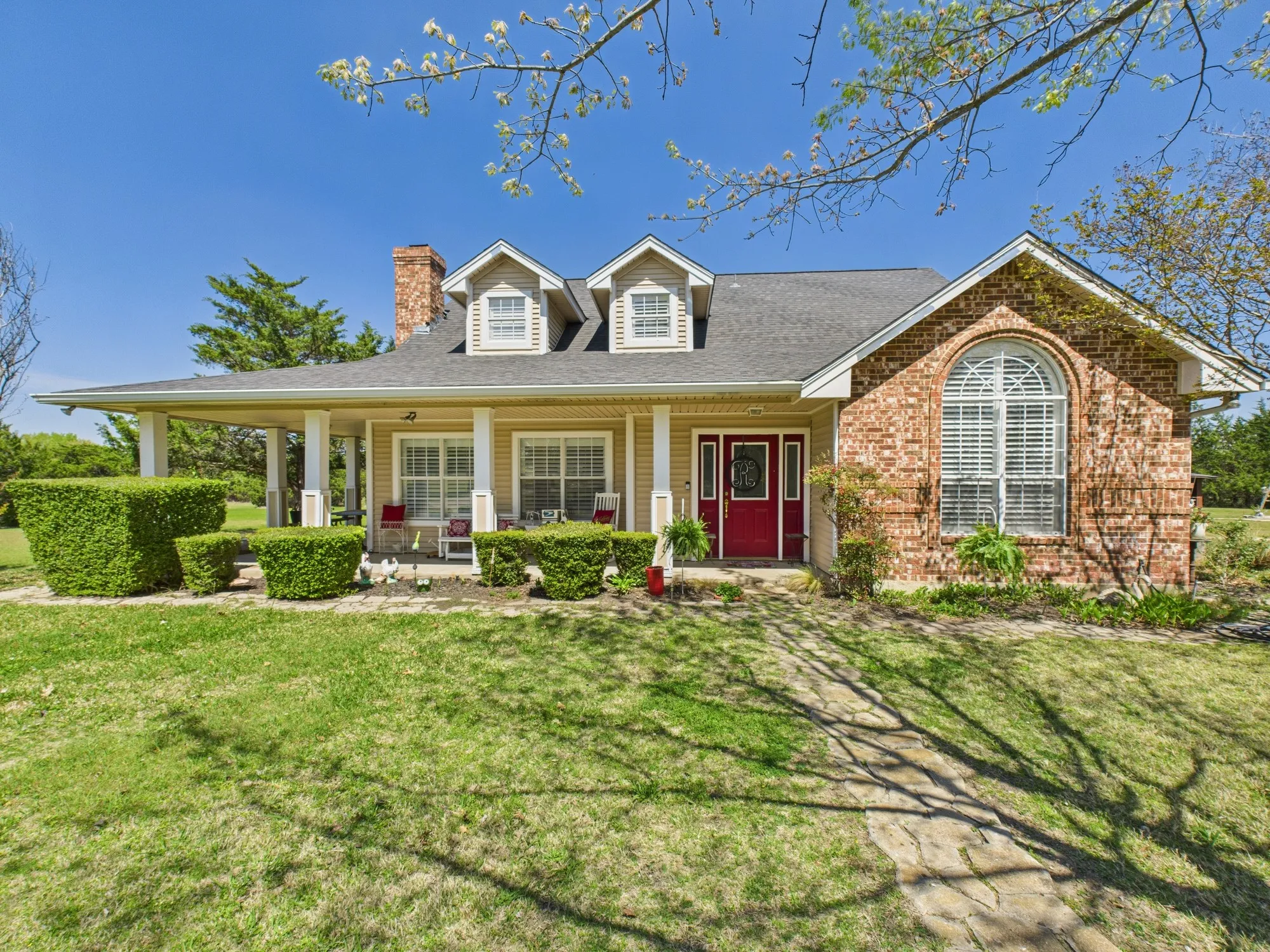 Front & side wrap around porch! Brick fireplace, landscaping