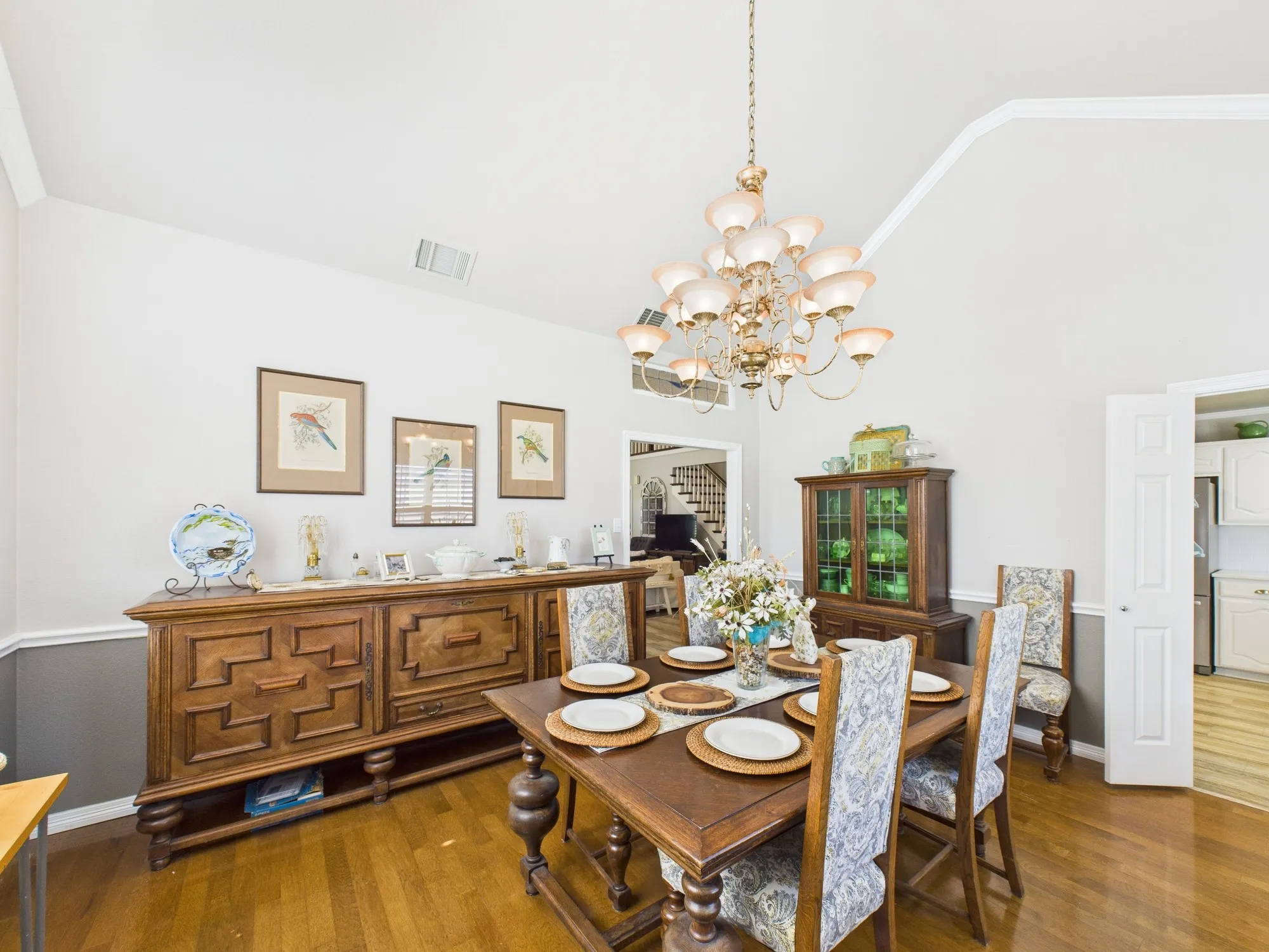 Another view of dining room opens up to the kitchen and the living room, wood flooring
