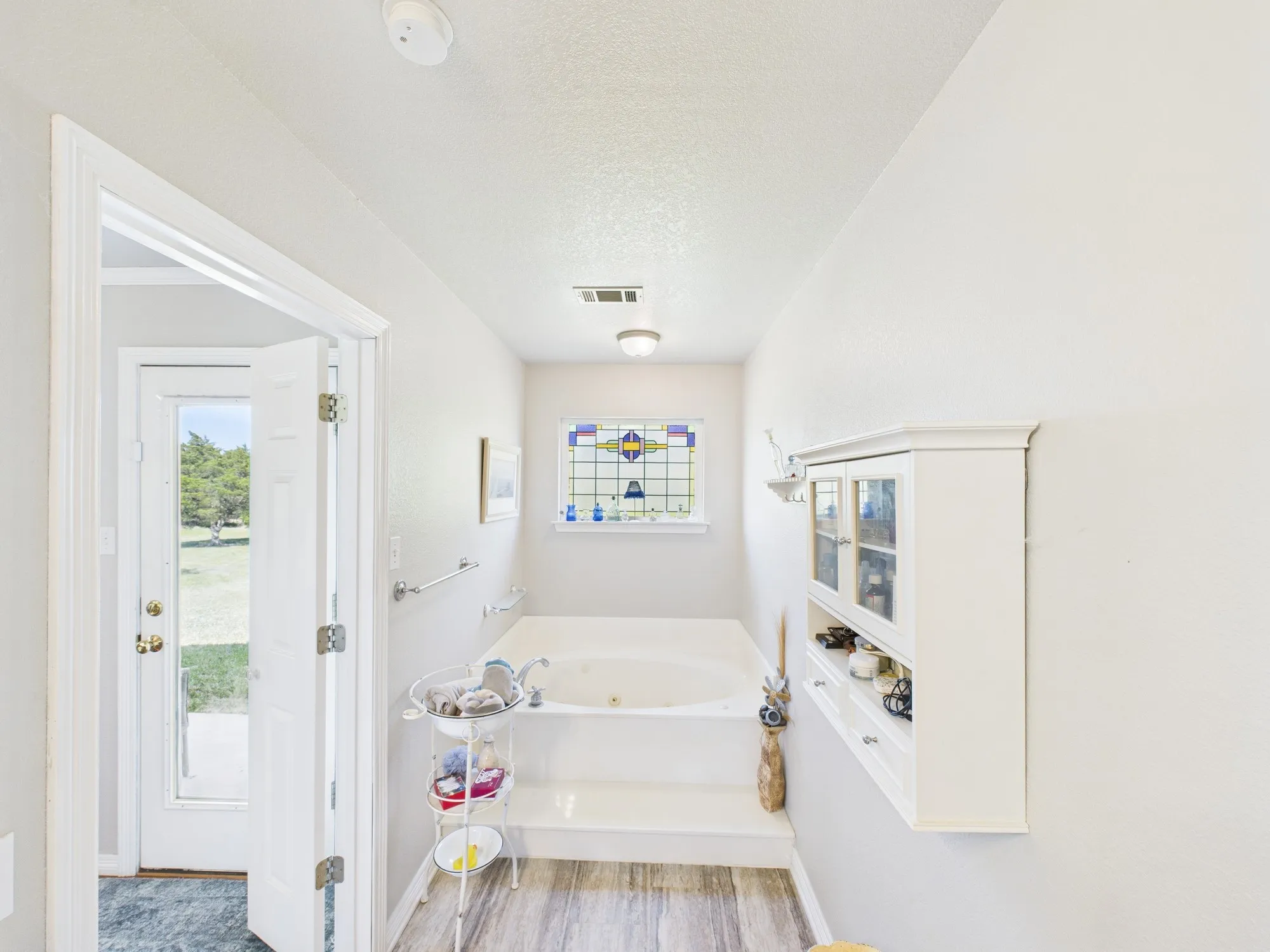 Tub and separate shower, stain glass remains