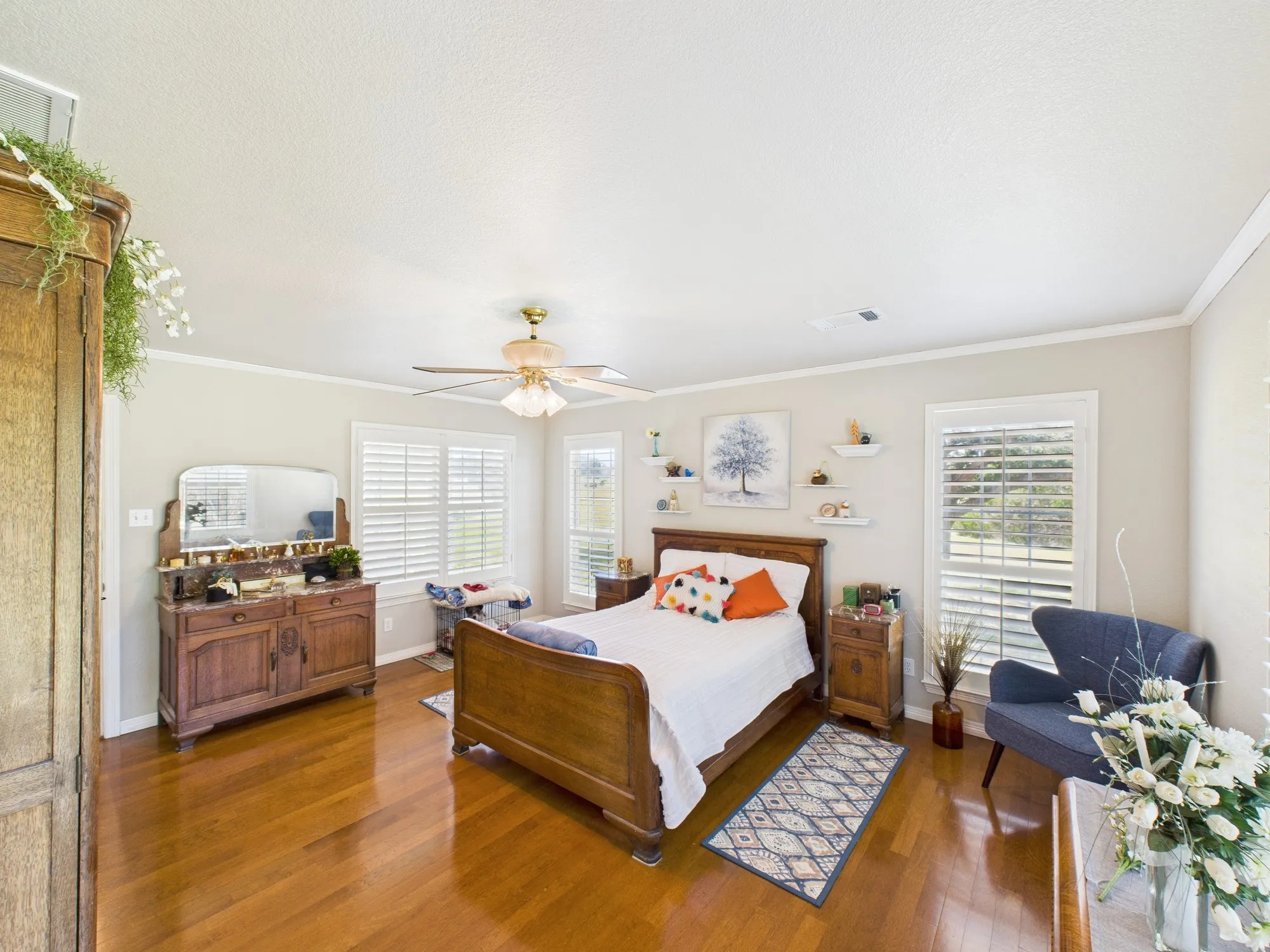 Another view of master bedroom with wood floors