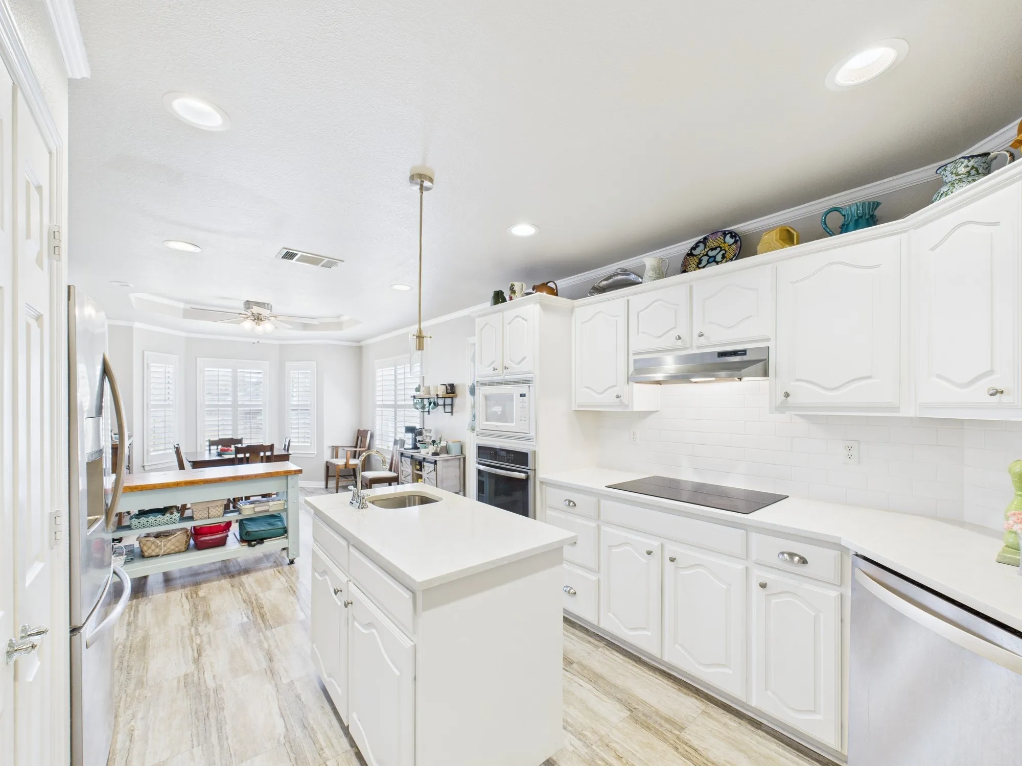 Marble look countertops, subway tile backsplash & flooring updated kitchen 5 yrs ago