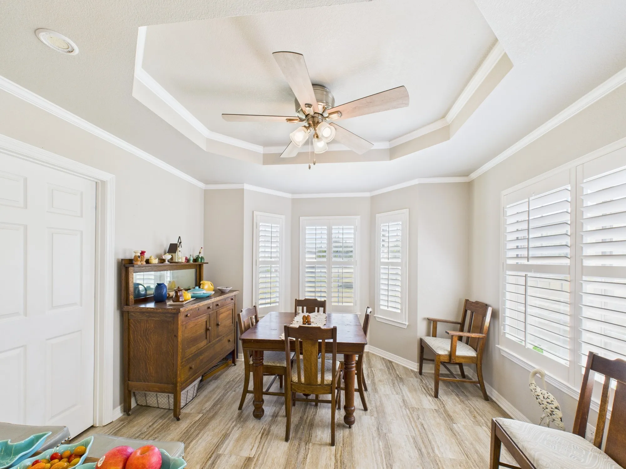 Breakfast area that sits in a bay window design, plenty of room for a table with 2 leafs & more chairs, plantation shutters throughout