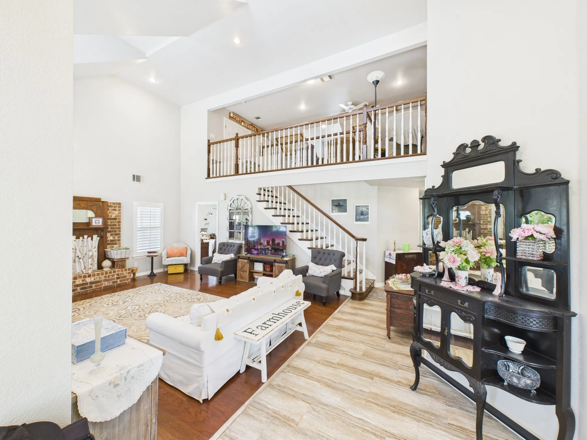 Entry way opening up to very tall ceilings in living room