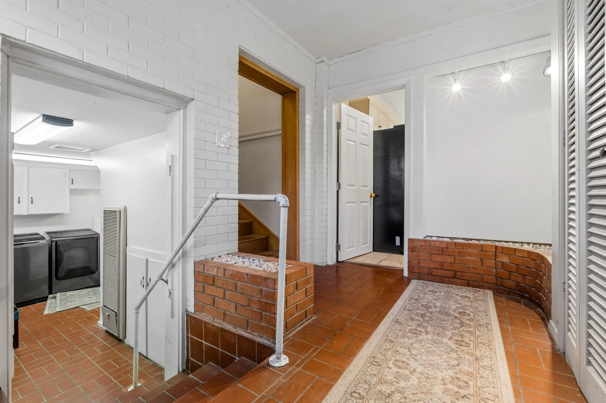 Large Laundry Room and Entrance to Garage Apartment and Main Kitchen
