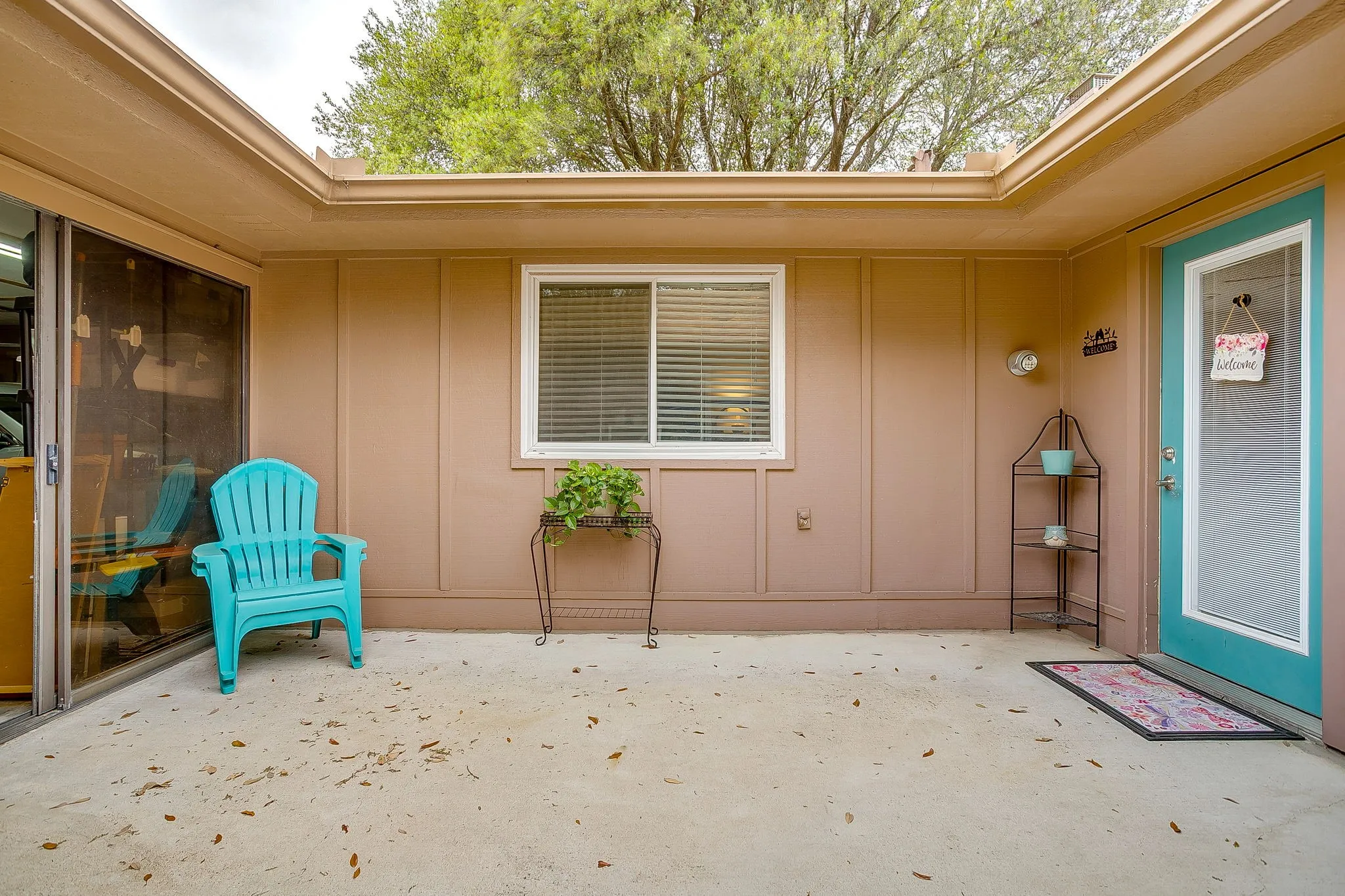 Courtyard out the back door, with entrance to garage
