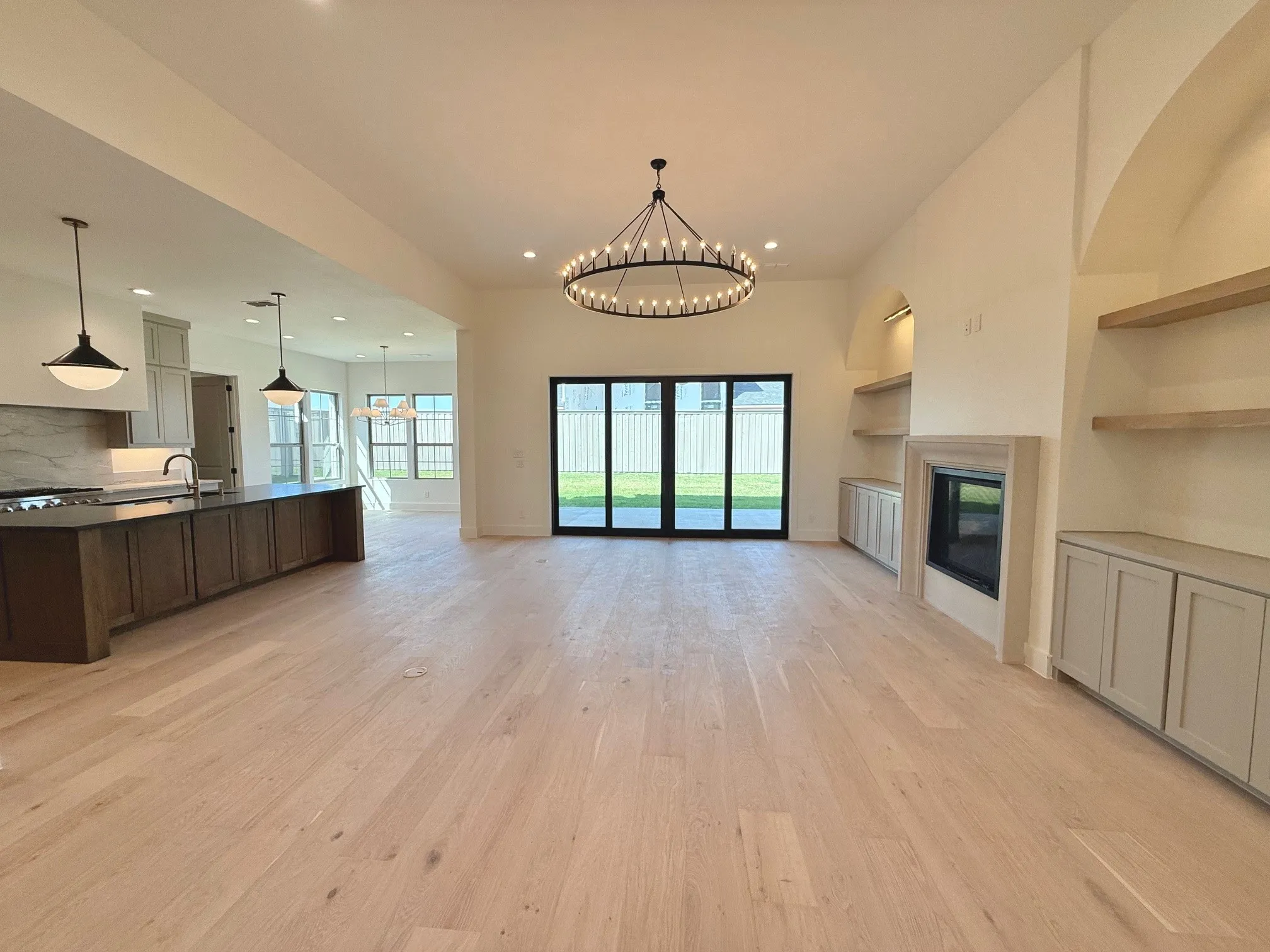 Downstairs living area. Large sliding rear to door to the back porch. Open Concept floor plan.