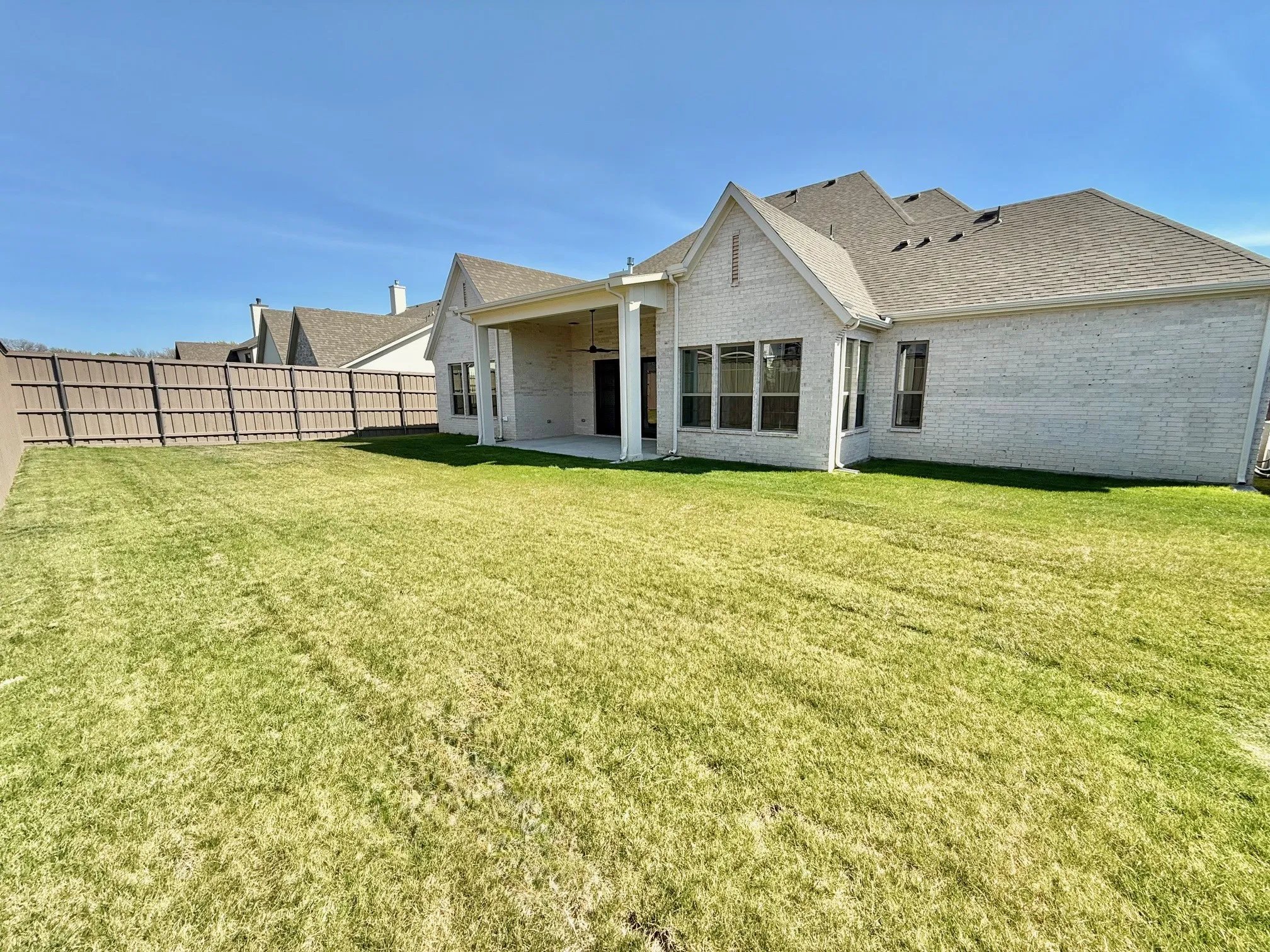 large, usable backyard with 8' wood privacy fence