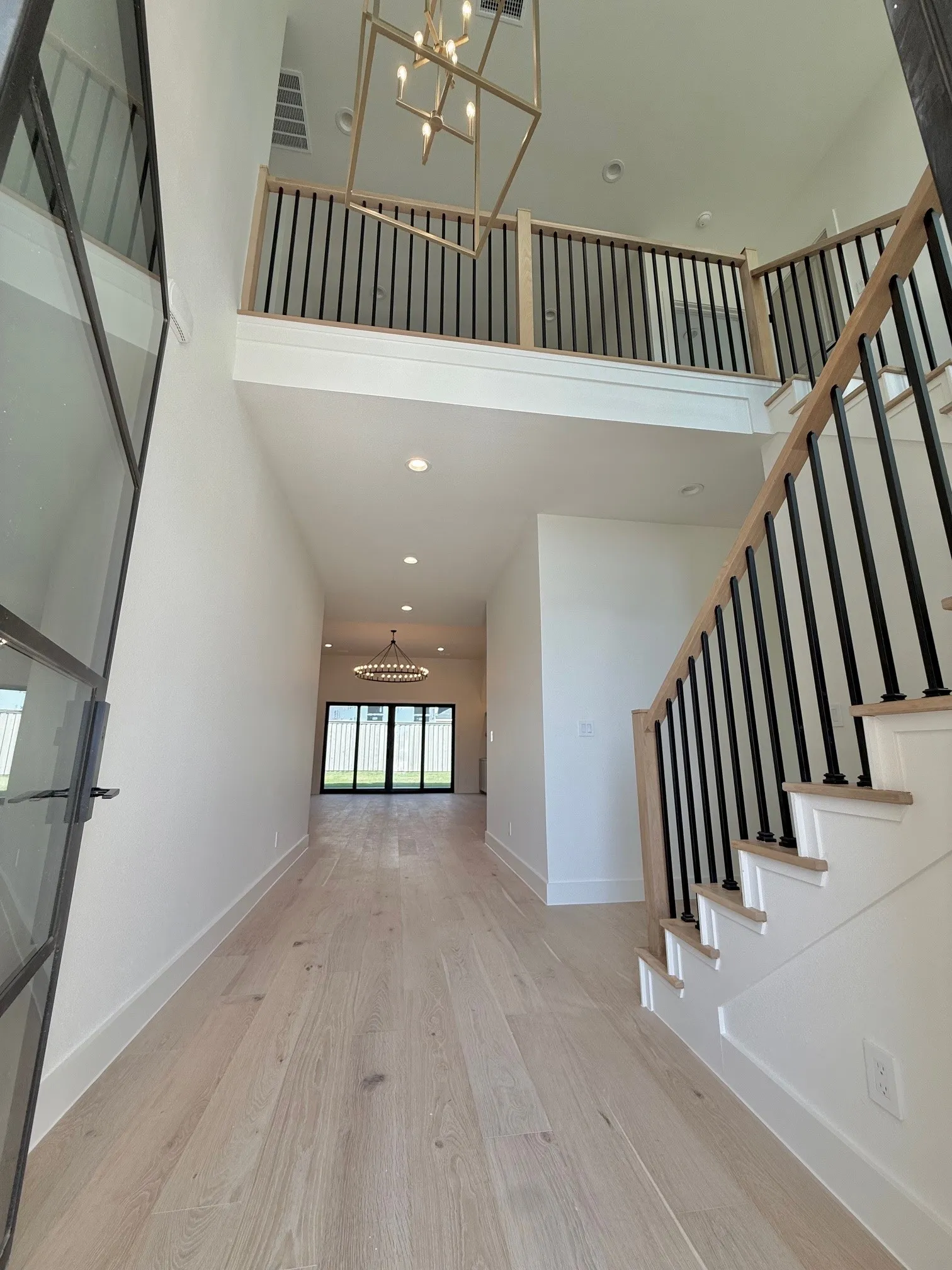 Looking from the entrance towards the loft upstairs and the downstairs living area.