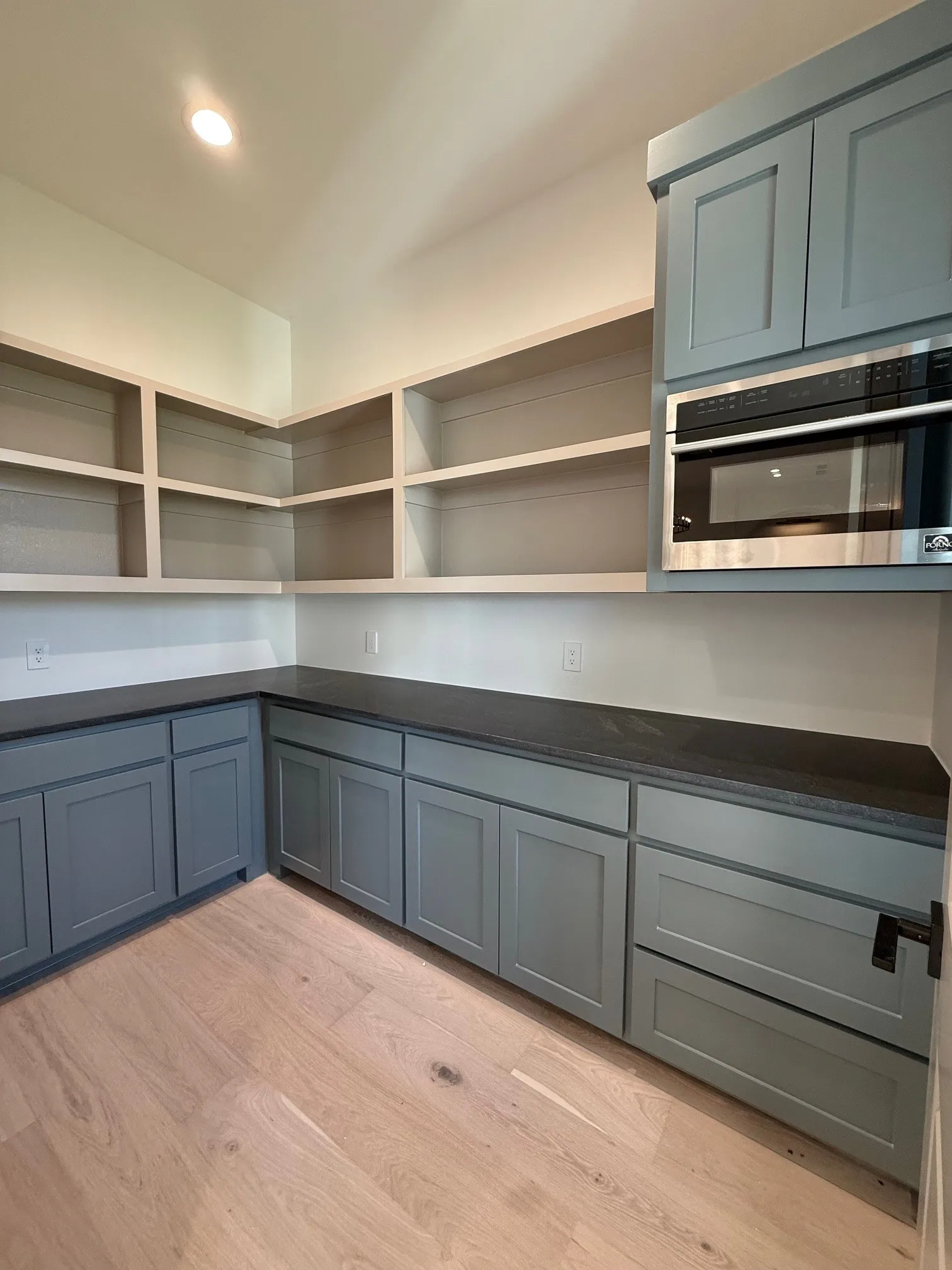 Large Pantry, with custom cabinets, counter tops and built in microwave