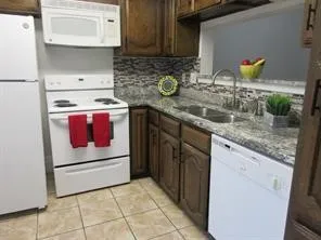 Pretty kitchen with door to patio