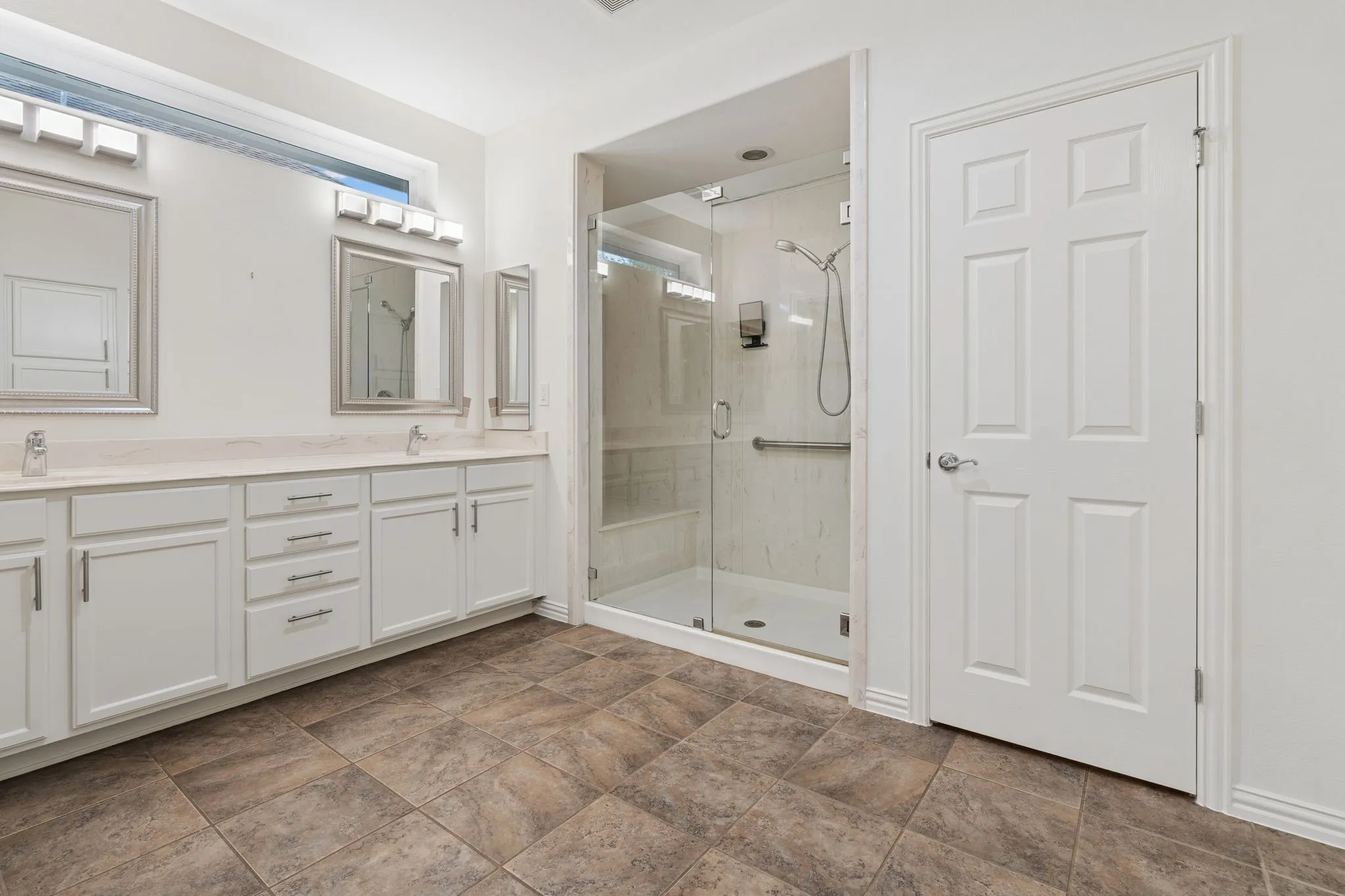 Large shower, dual sinks and plenty of counter space