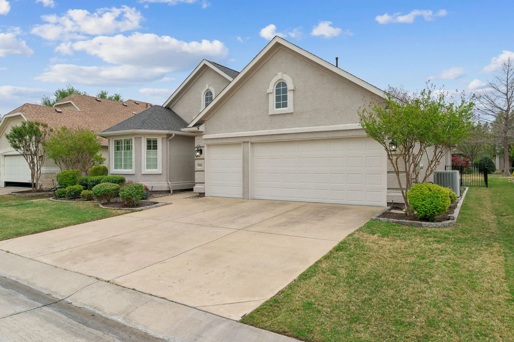 An oversized 2-car garage and separate golf cart garage