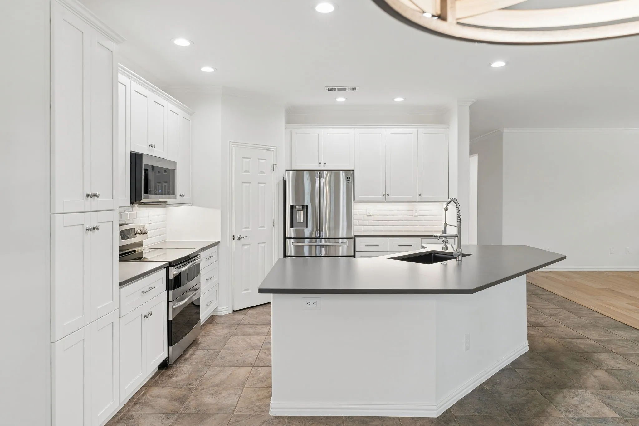 Huge island with premium quartz countertops and lots of cabinet space