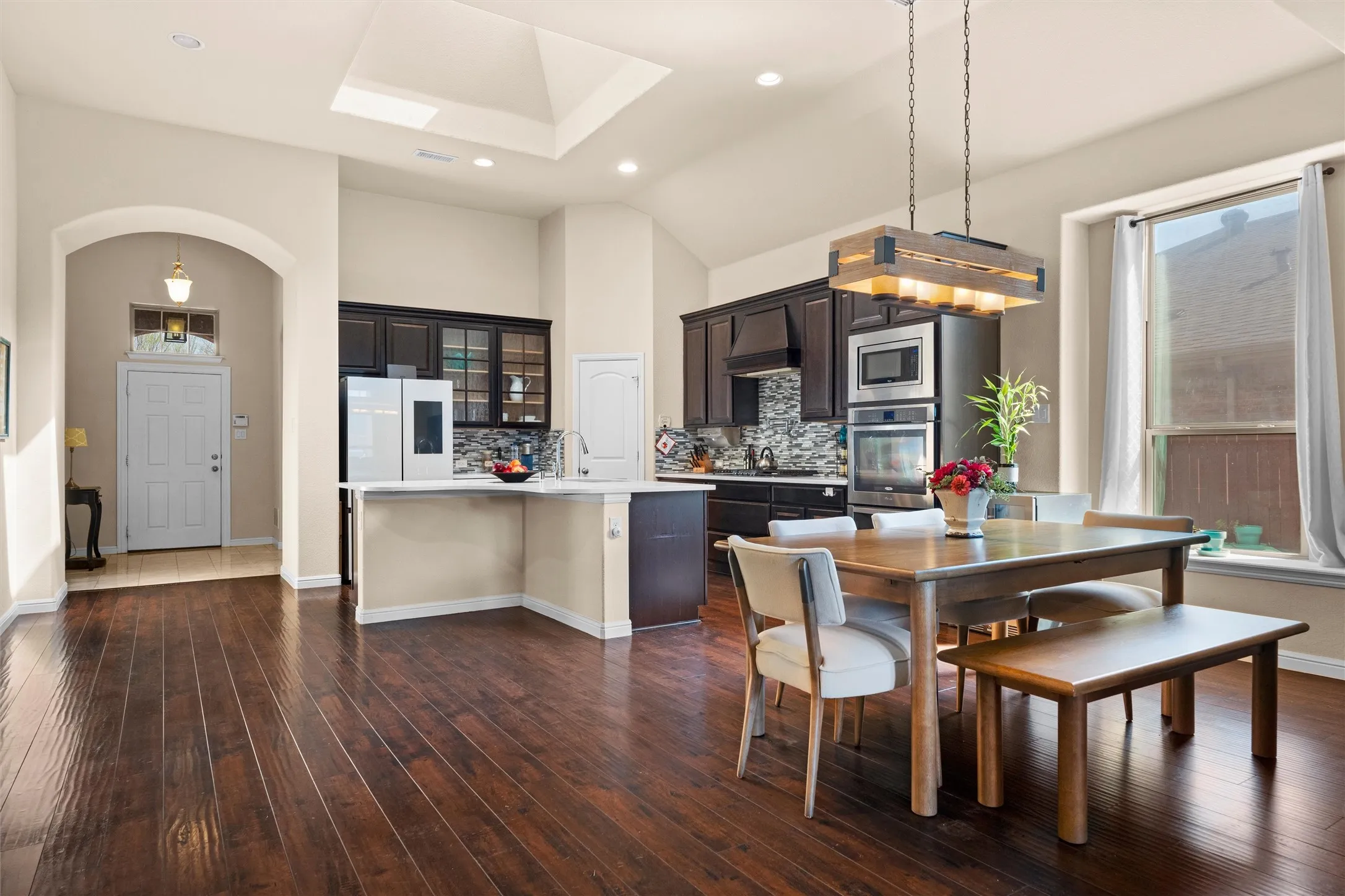This Plantation Home features open concept living, with high ceilings, custom light fixtures and LVP flooring. The skylight allows fantastic natural light useful when cooking and entertaining.
