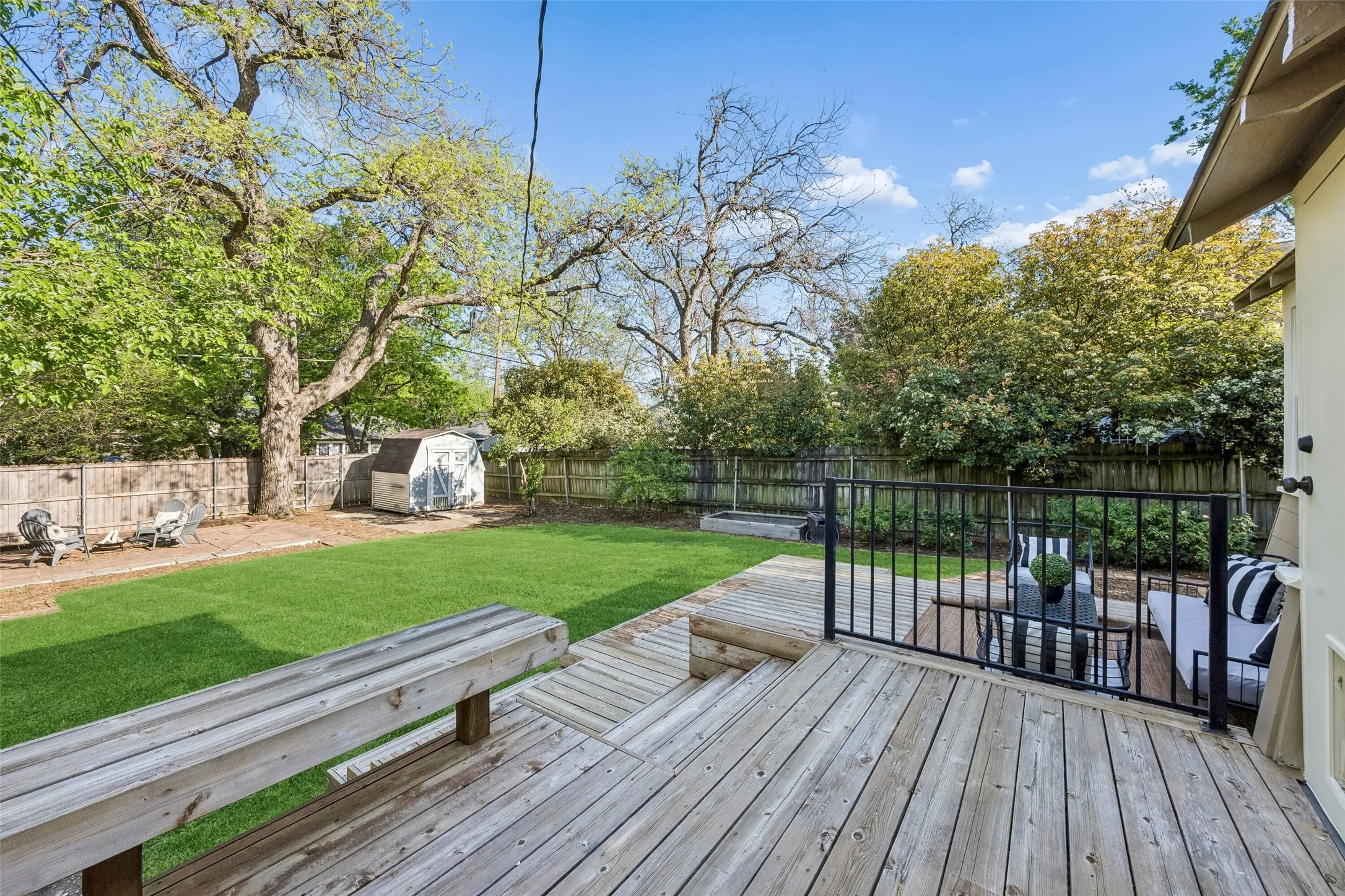 The large back yard begins with a very large deck....room for grilling and chilling.
The garden is ready for spring. Even a second shaded sitting area for fireside chats and s'mores.
