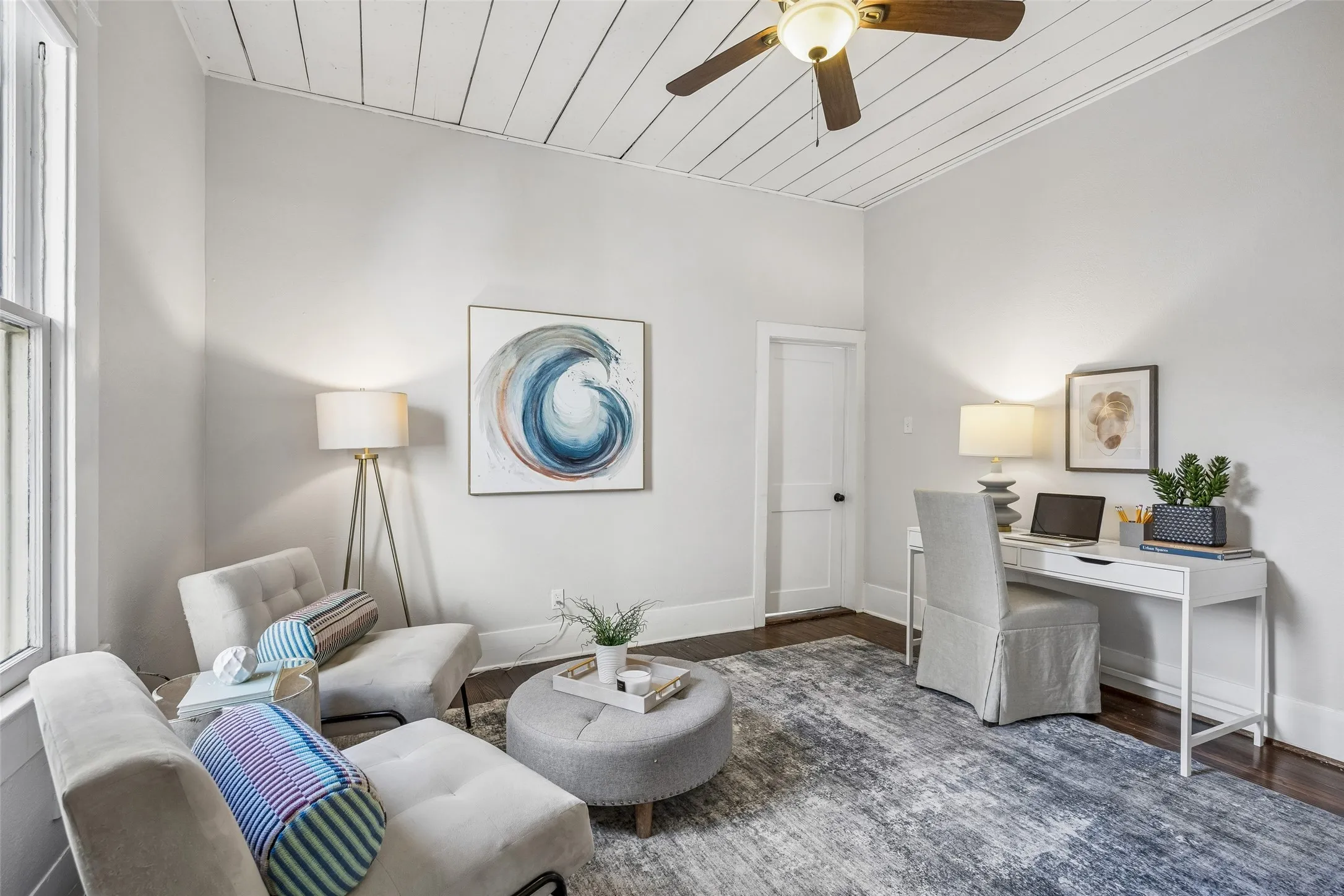 The versatile second living space is currently used as an office, but it could easily be a fourth bedroom, nursery, library, or playroom.