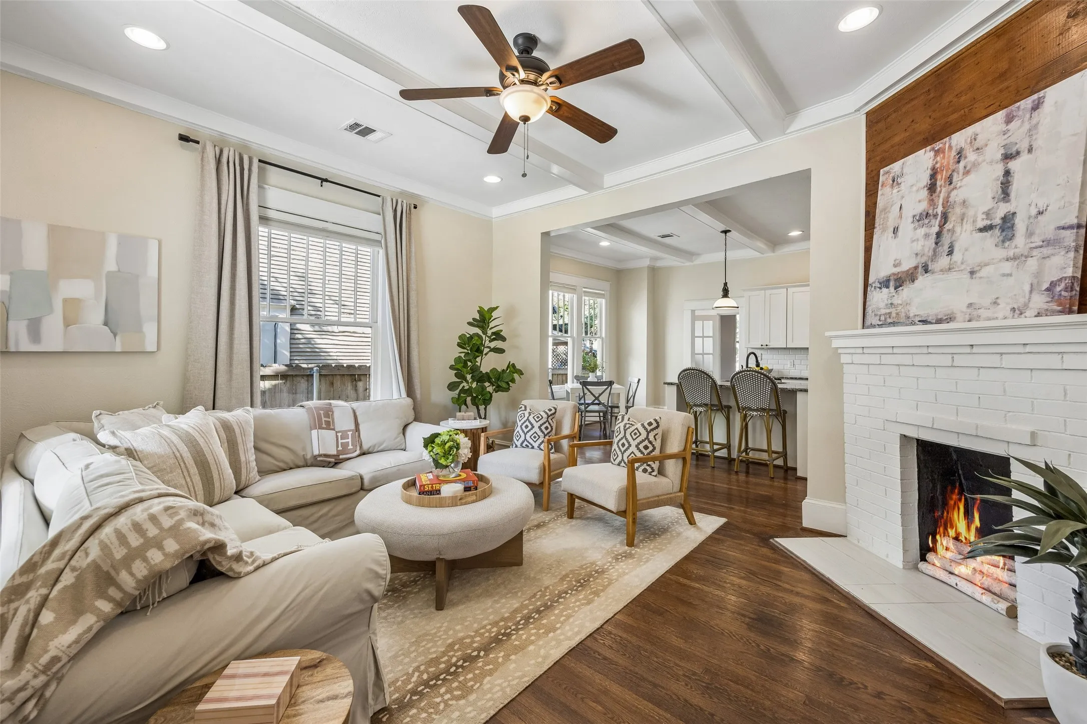 High beamed ceilings add visual space. Such a comfy space.
