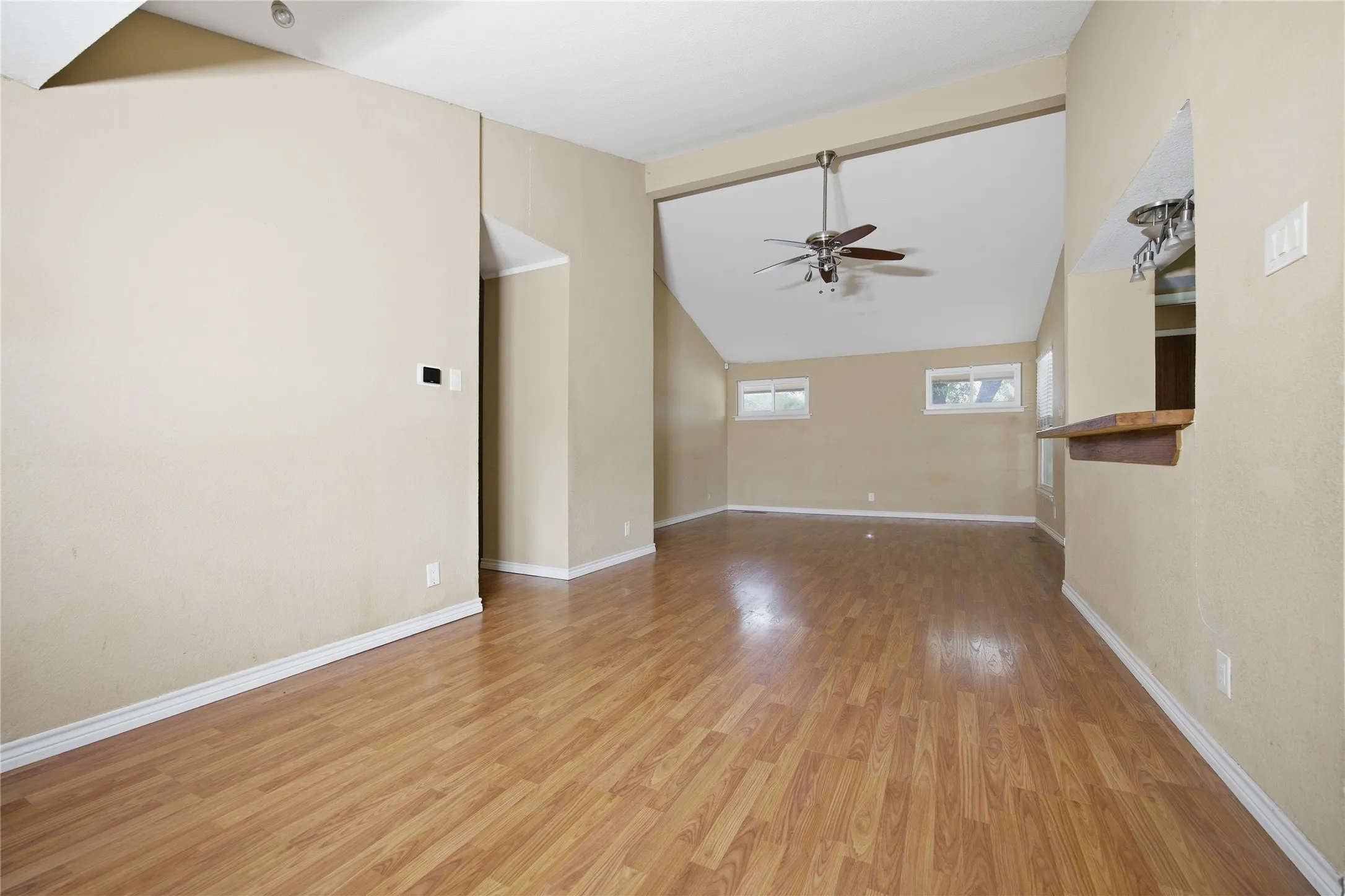 The flow of the beautiful flooring makes the lay-out feel large.