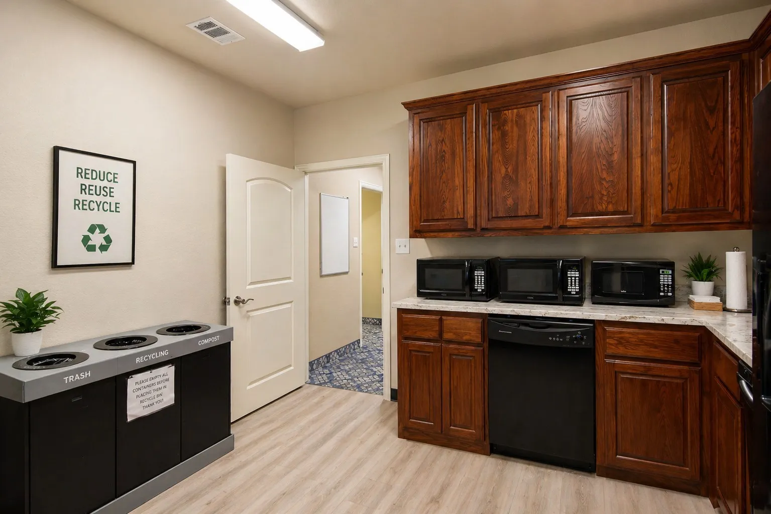 Well-appointed kitchen area featuring rich wood cabinetry, light-toned countertops, and wood-finish flooring