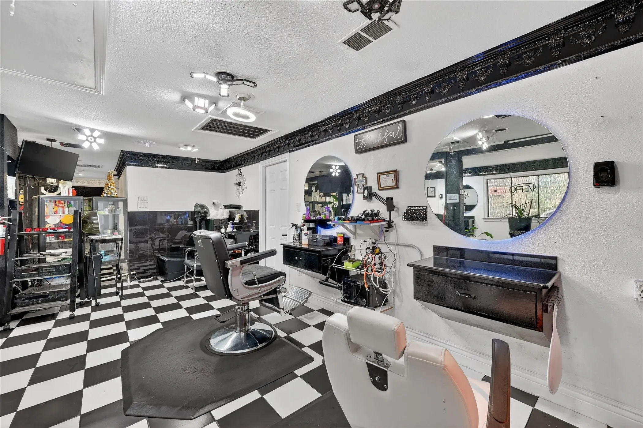 Open salon area with multiple styling stations.