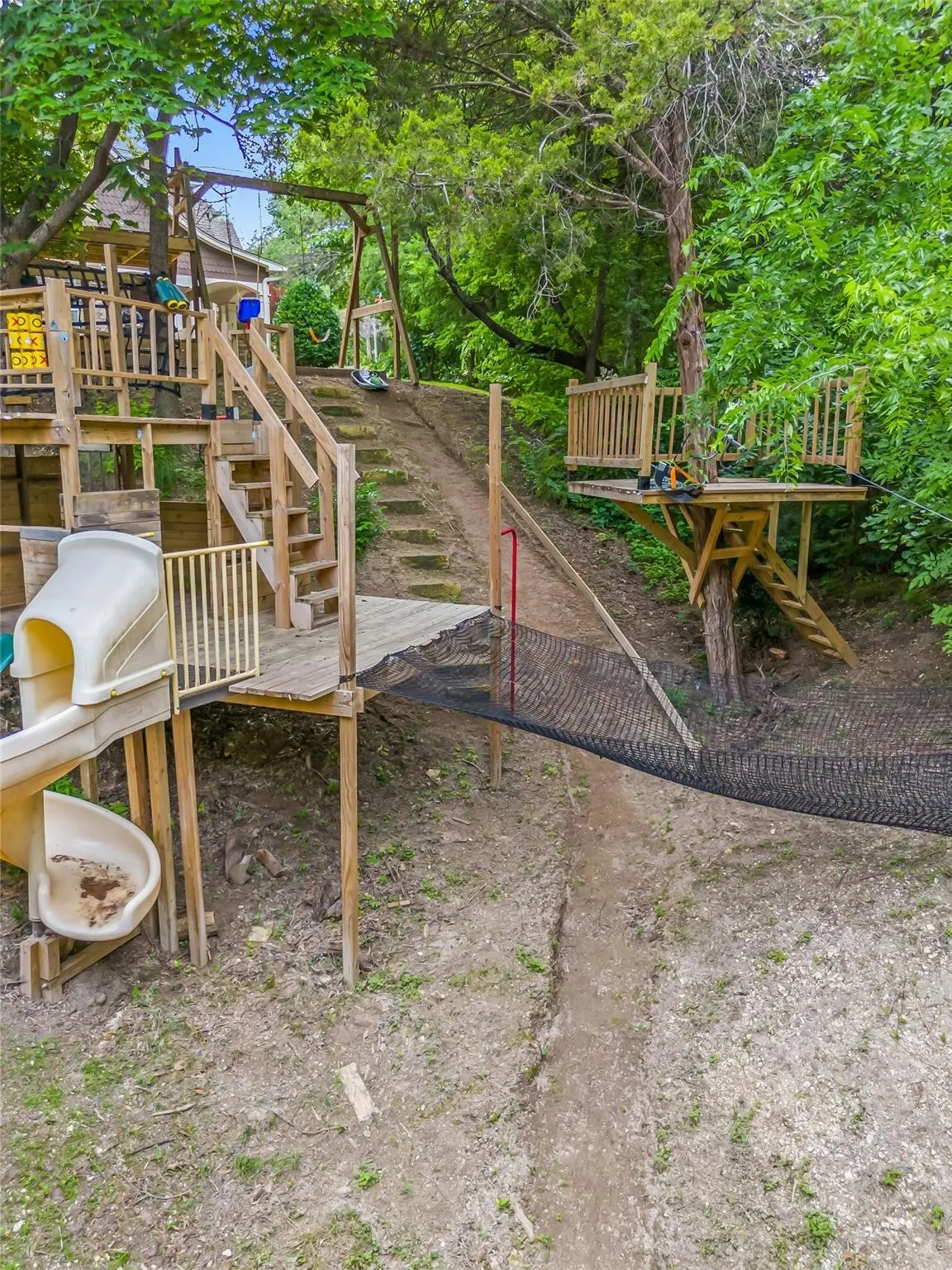 View of yard featuring stairway and a deck