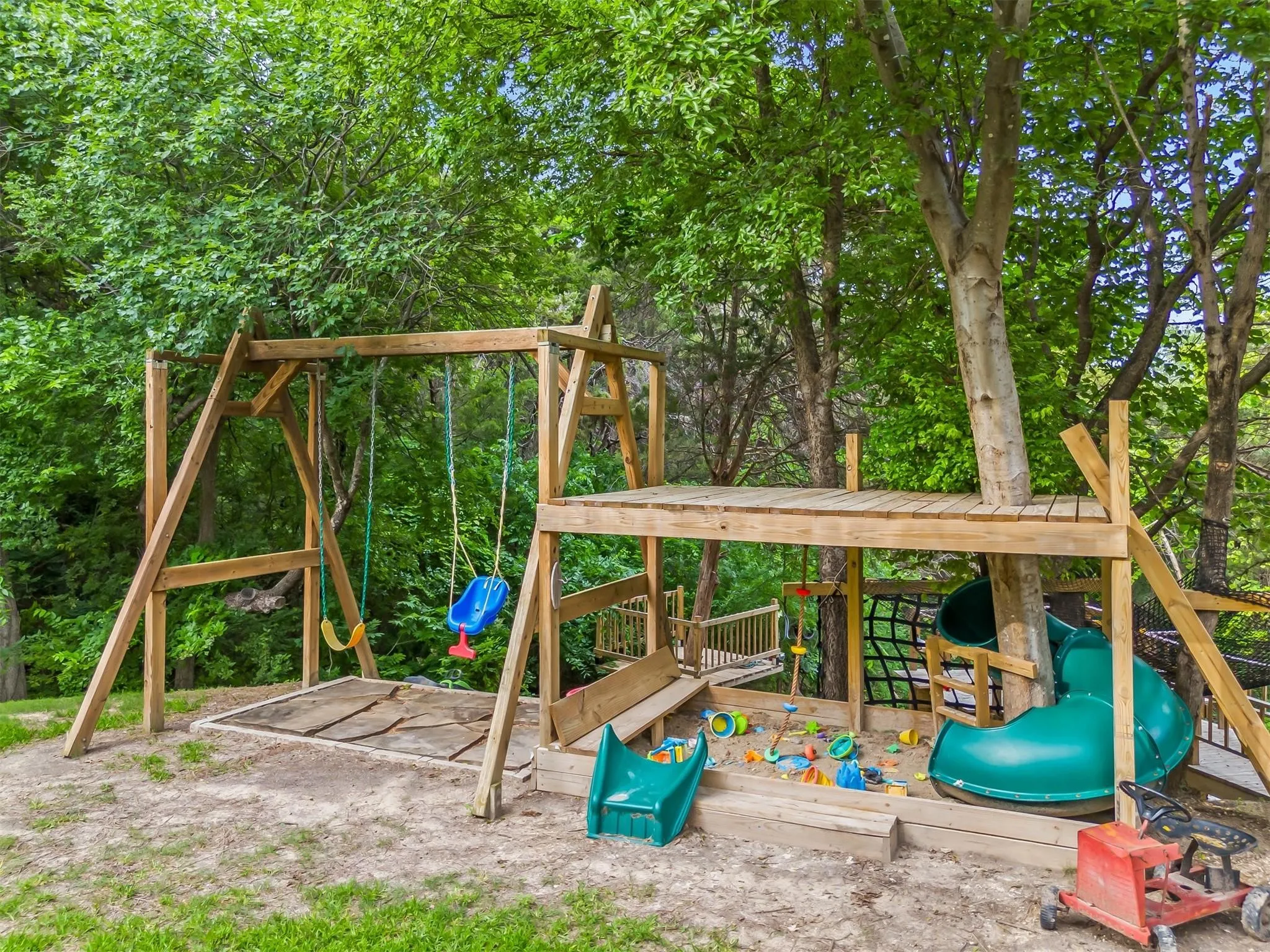 View of playground with a deck