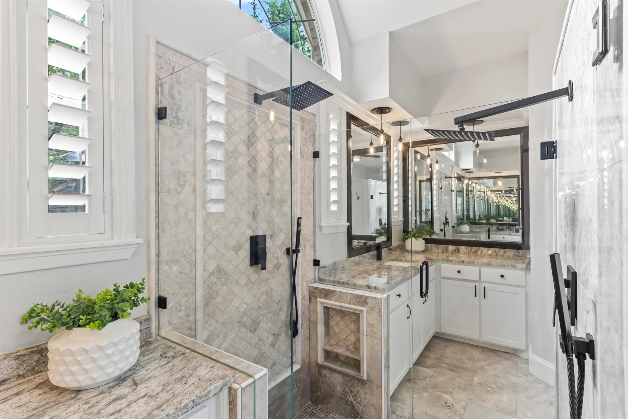 Full bath featuring vanity, a shower stall, and a high ceiling