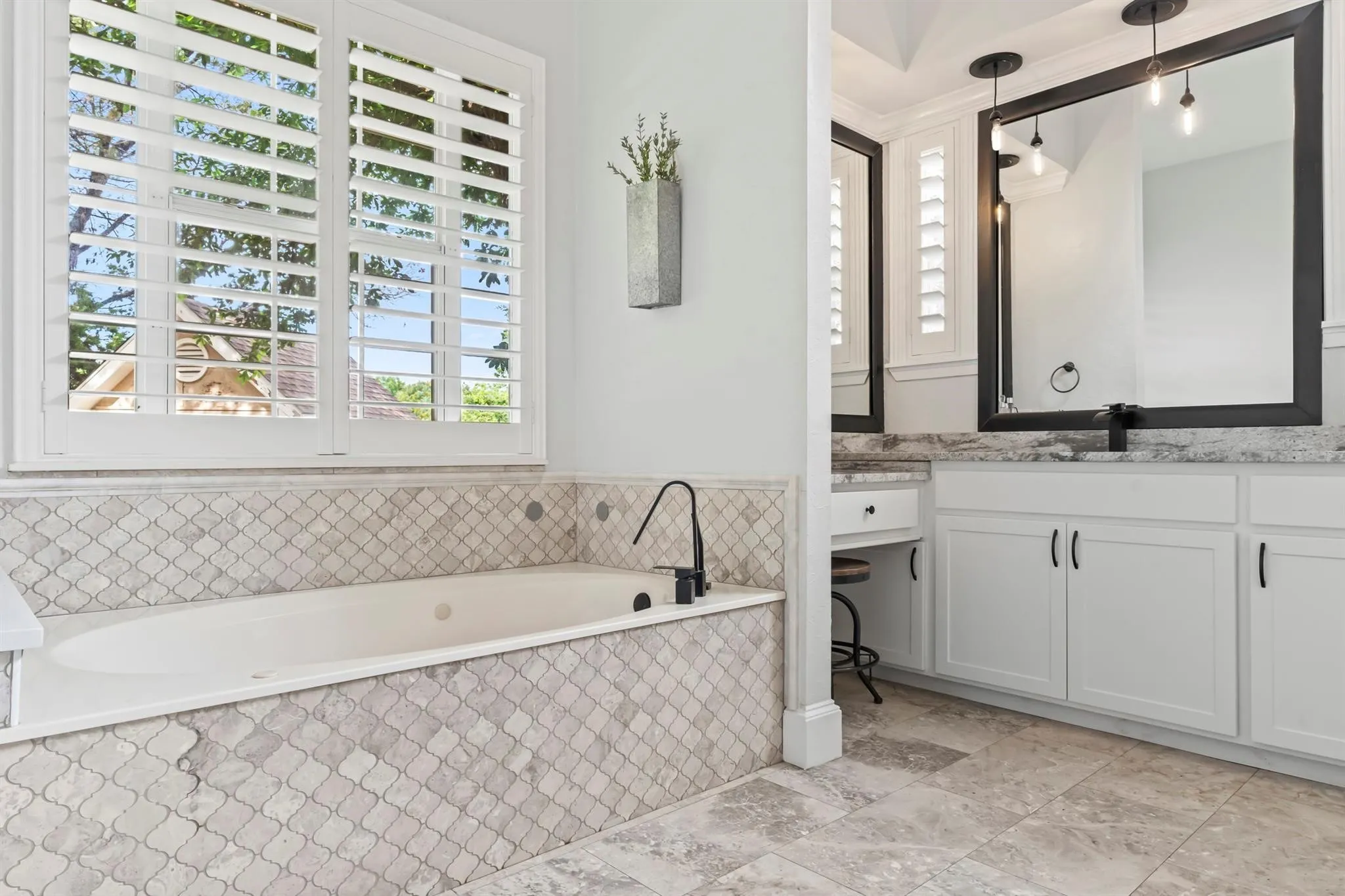 Bathroom featuring vanity and a bath