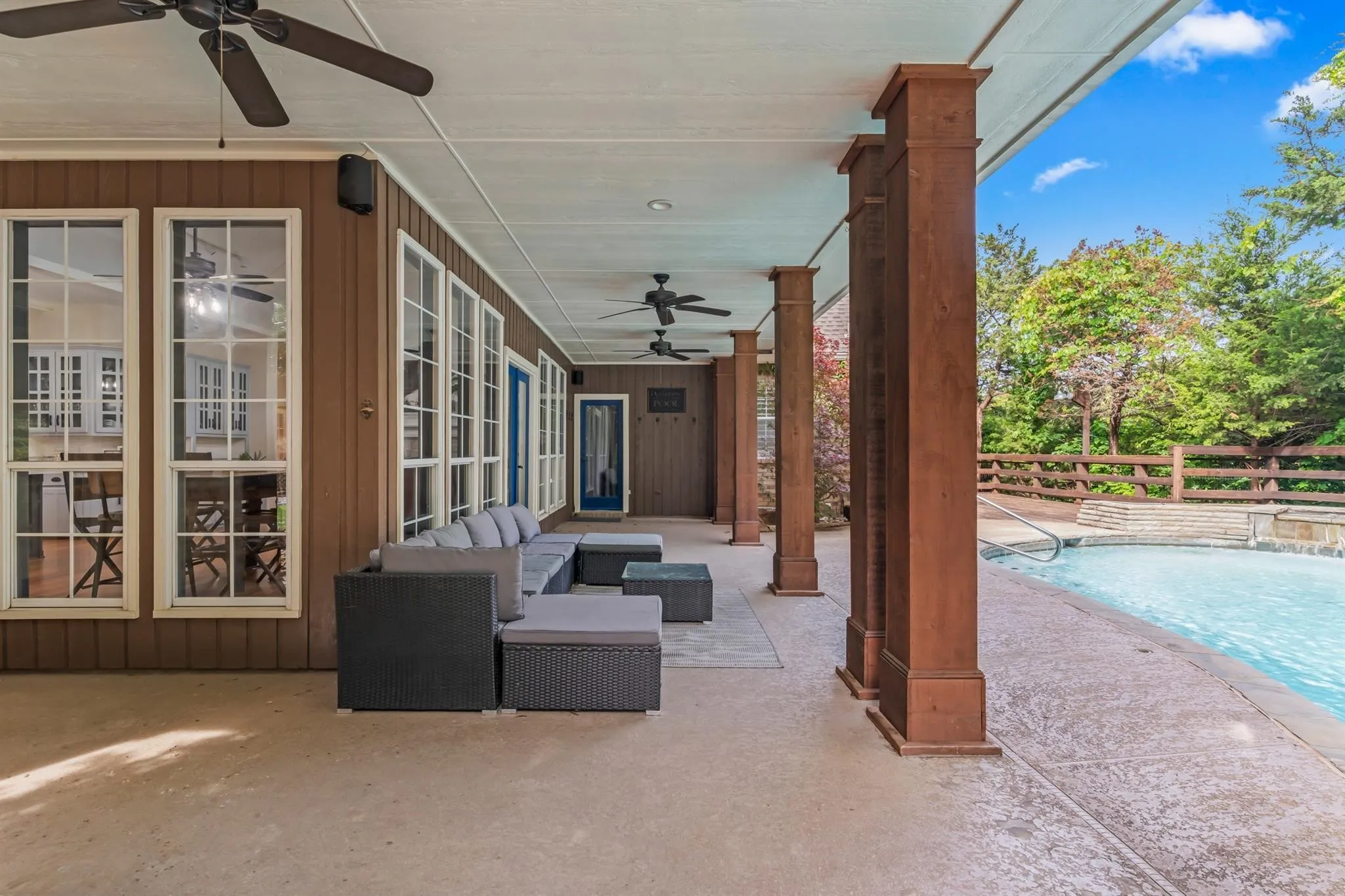 View of patio with ceiling fan, an outdoor pool, and outdoor furniture