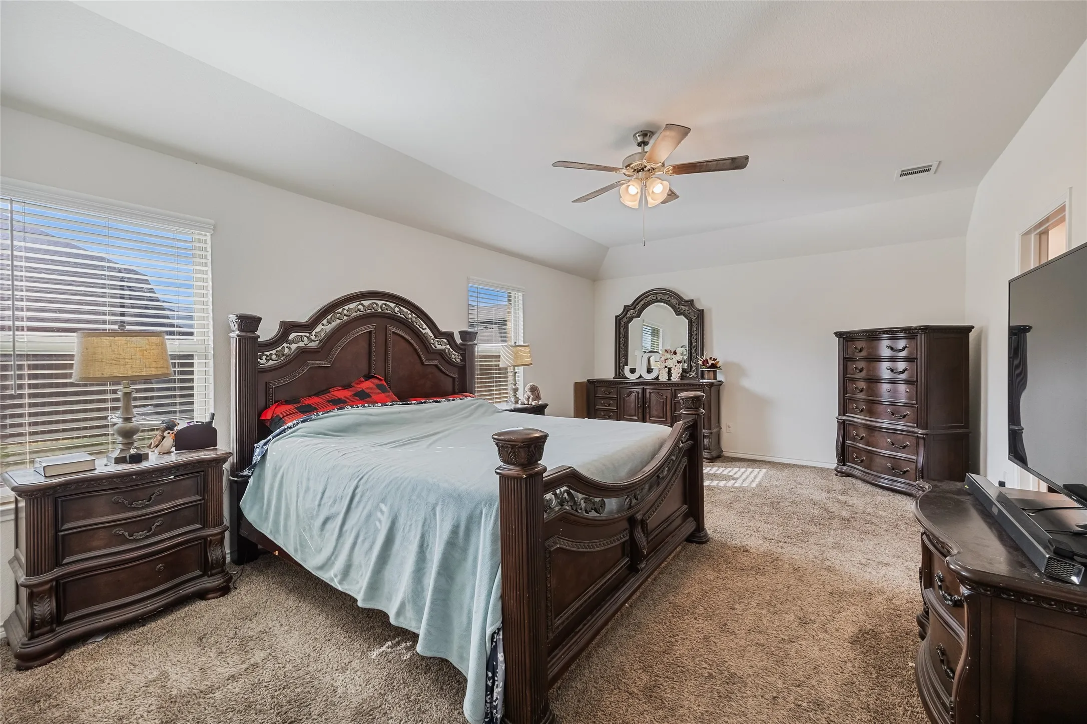 Oversized primary bedroom located in back of home.