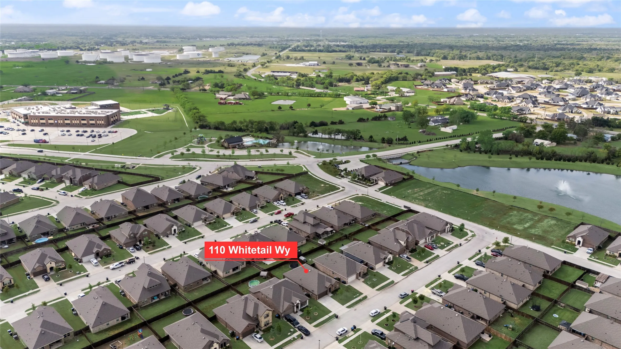 Aerial view showing the proximity of the home to the neighborhood amenities and on-site elementary school.