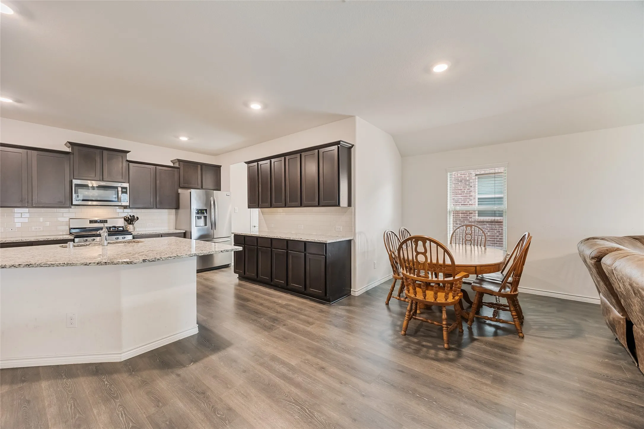 Breakfast nook located between kitchen and living room.