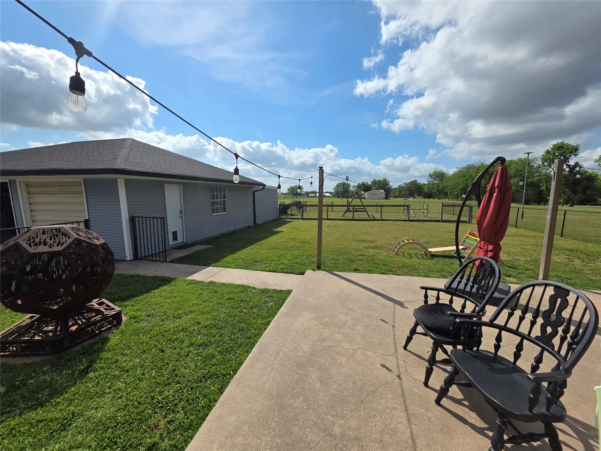 View of fenced backyard