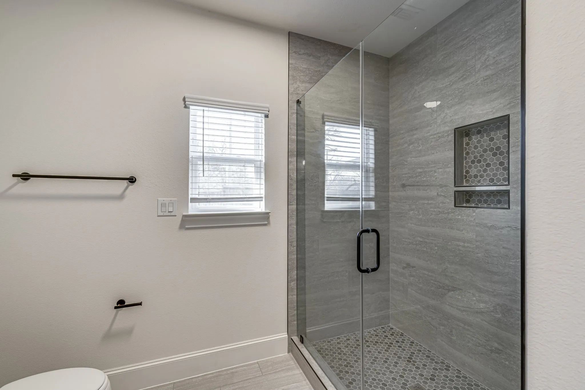 Full bathroom with a stall shower and wood tiled floors