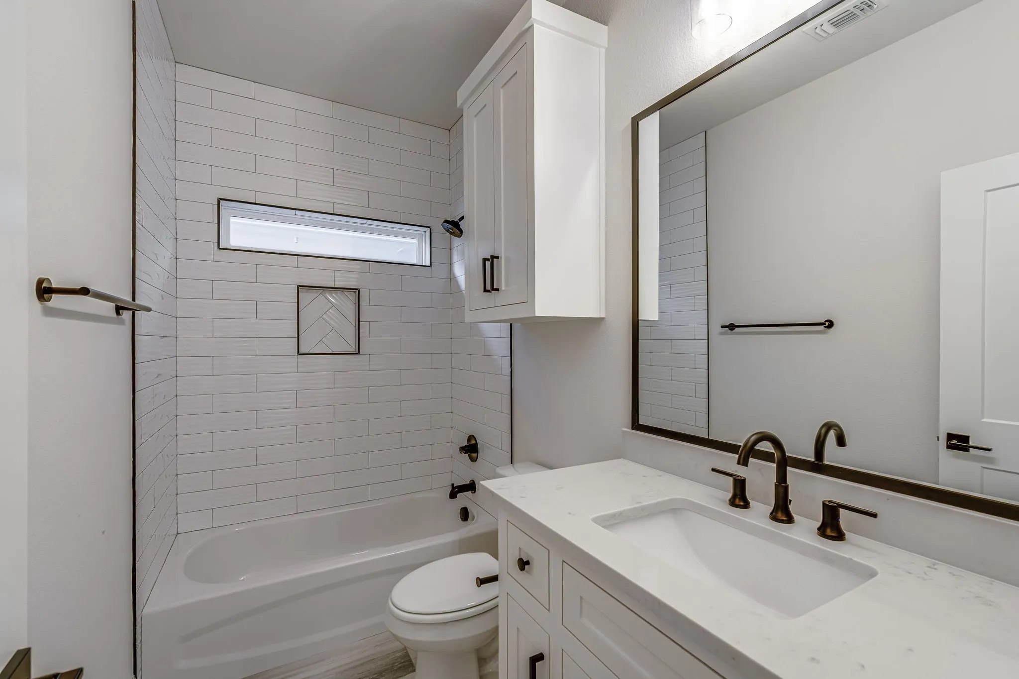 Bathroom featuring vanity and shower / bath combination