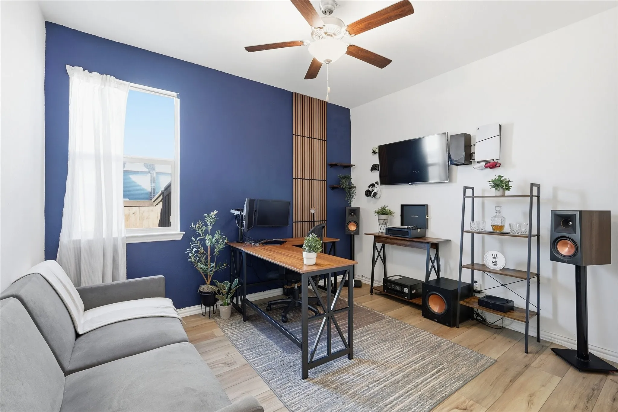 Home office featuring light LVP floors and a ceiling fan
