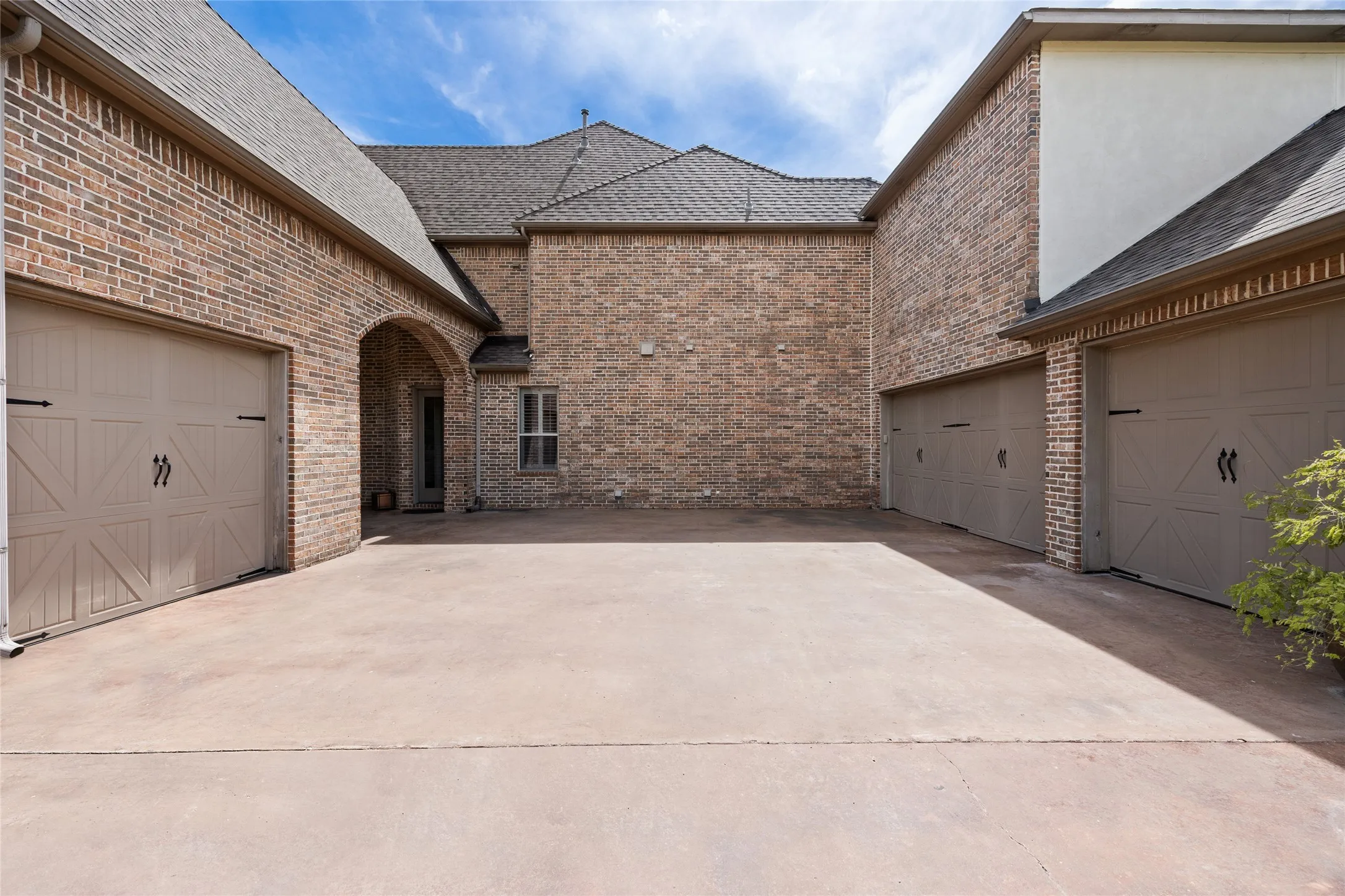 Gated courtyard and four car garage