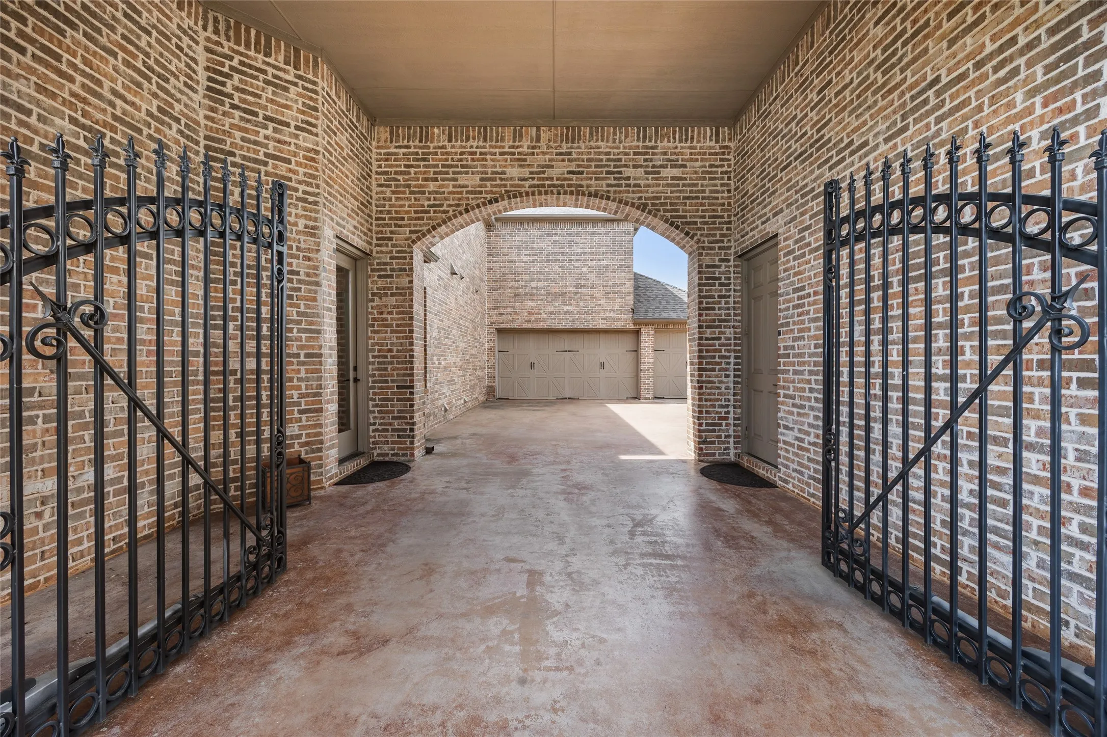 Gated courtyard by garage