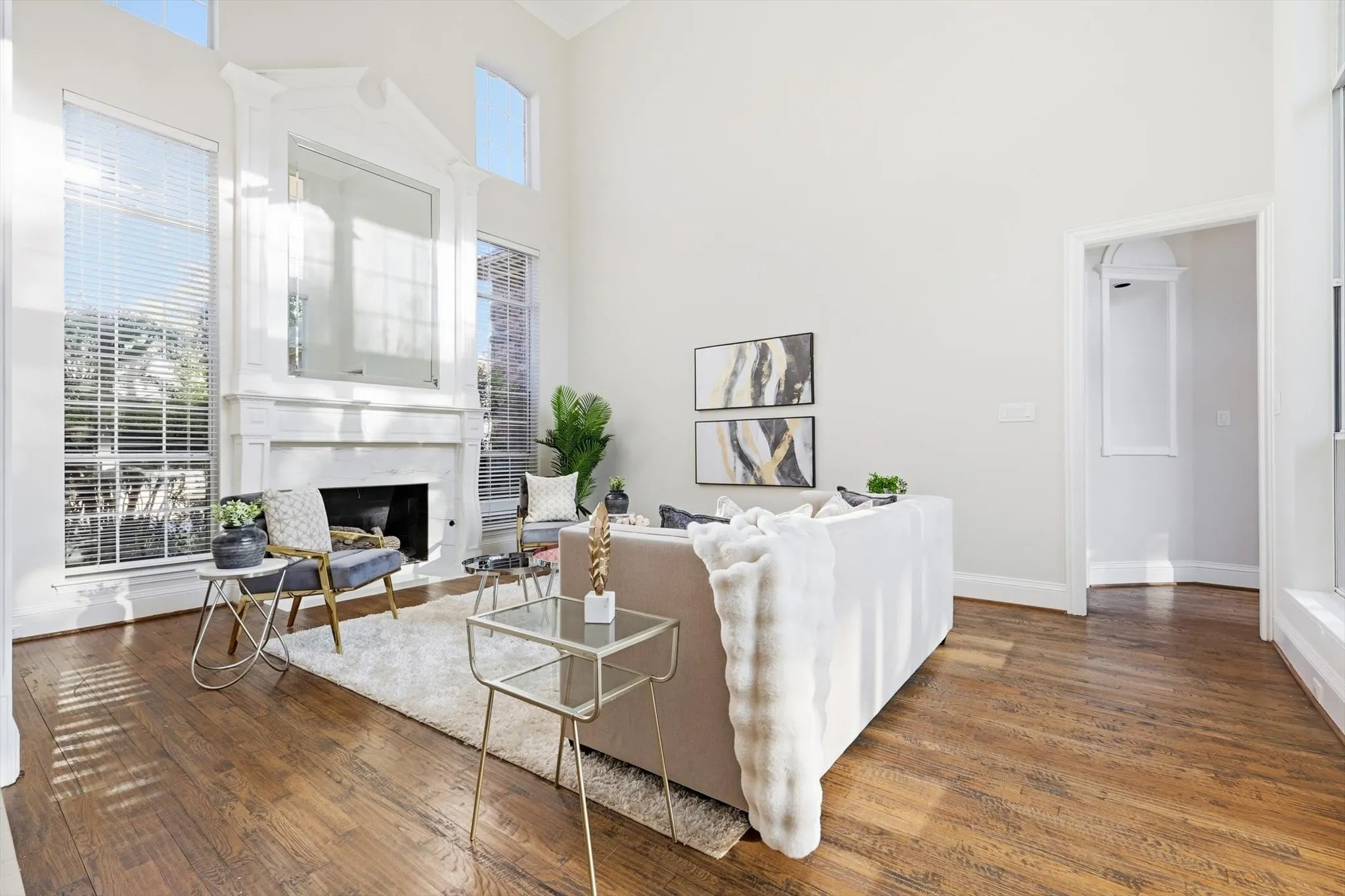 Light-filled front living room with view of back yard.