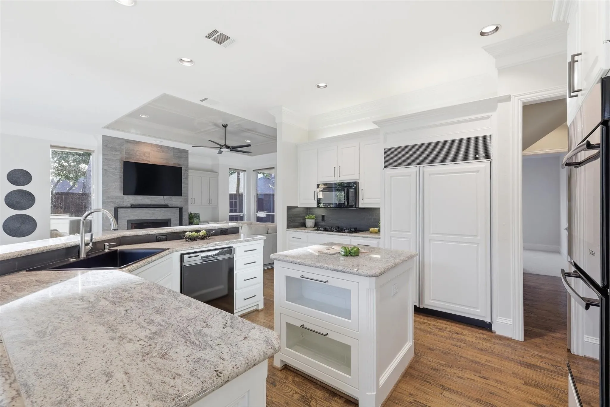 Oversized kitchen with gas stove, double ovens and open concept to living and casual dining. Perfect for entertaining or comfortably suiting your family.