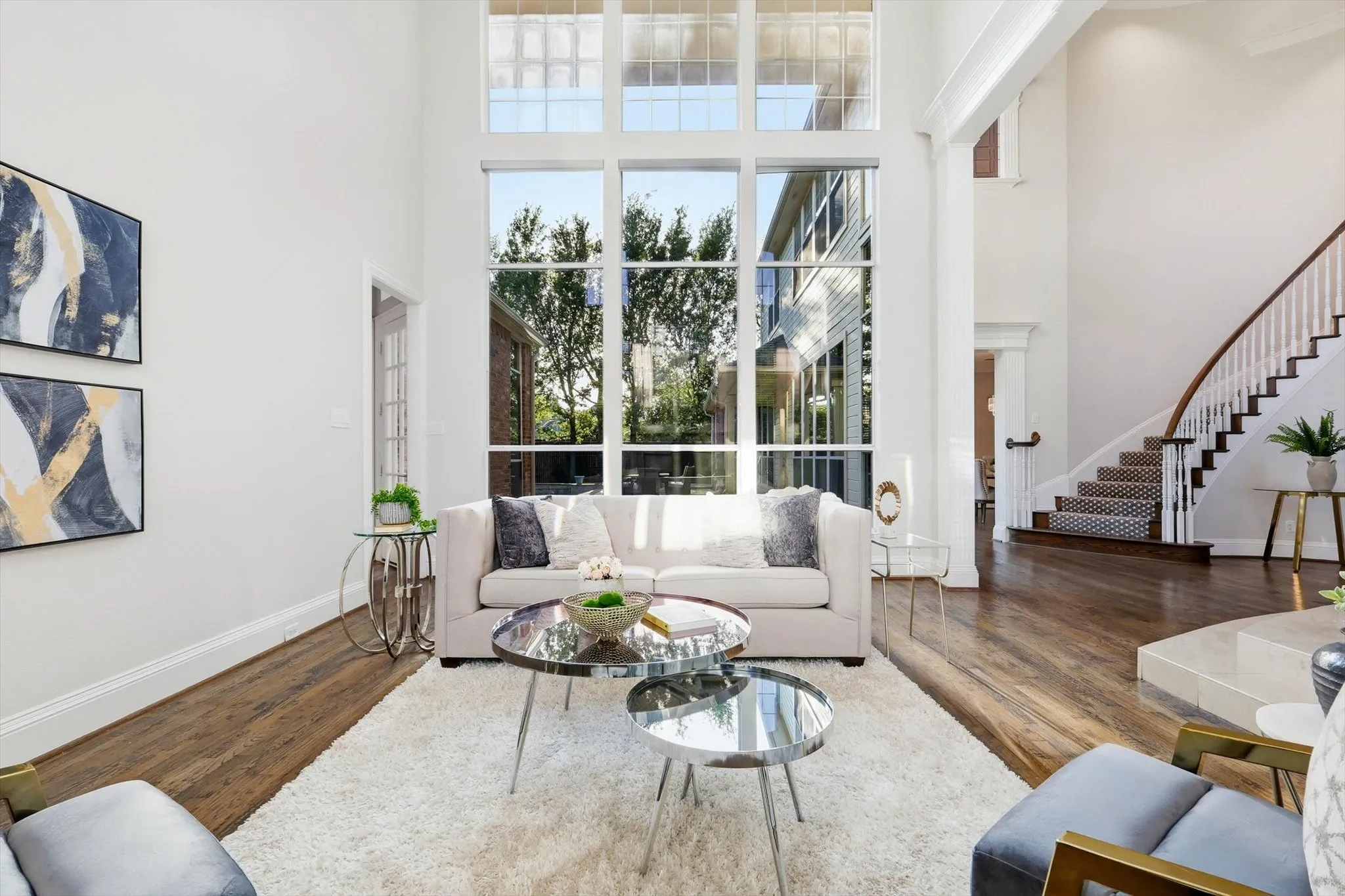 Light-filled front living room with view of back yard.