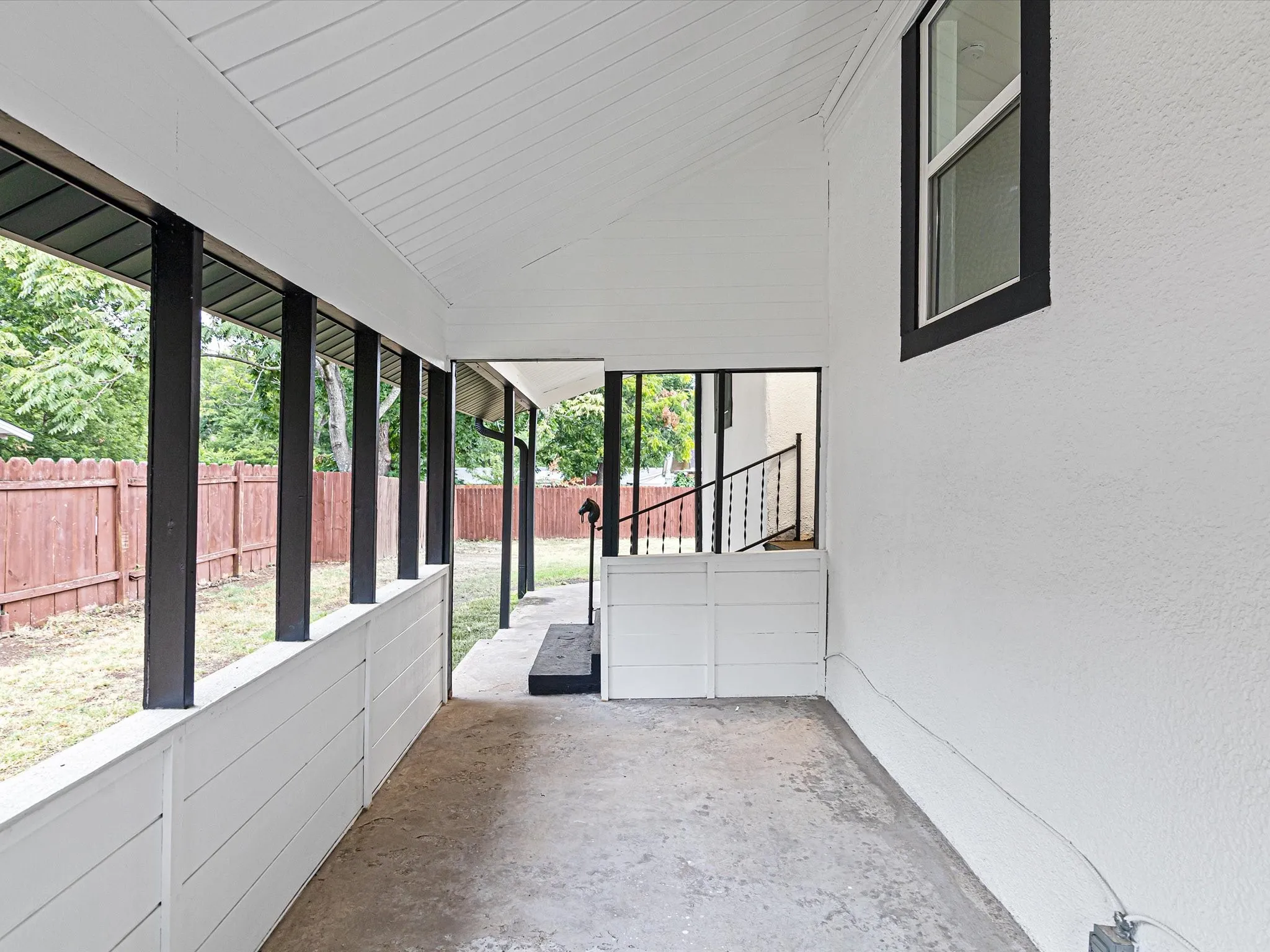 Back patio is spacious enough to fit lots of furniture in multiple places.
