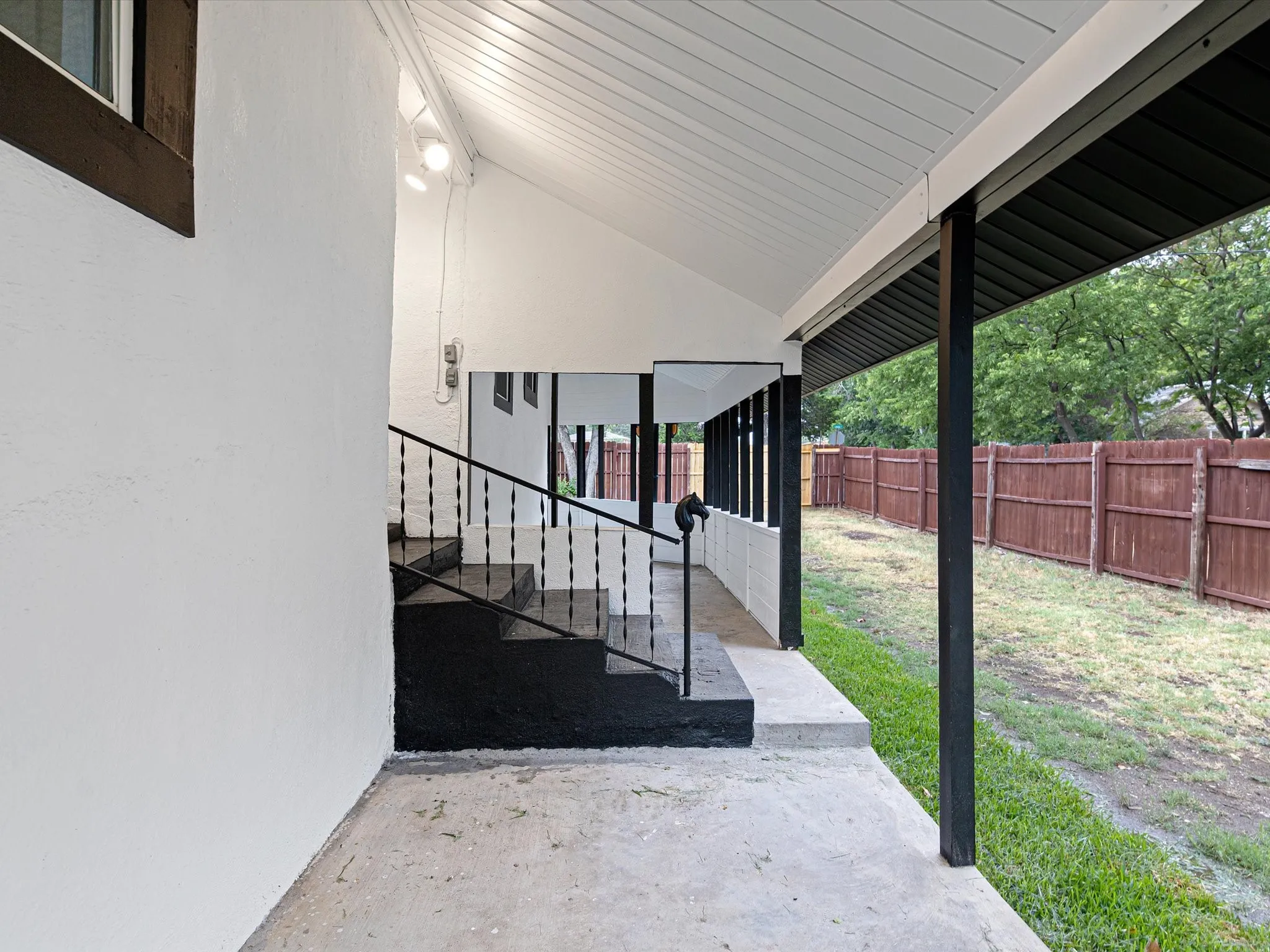 Back patio is spacious enough to fit lots of furniture in multiple places.