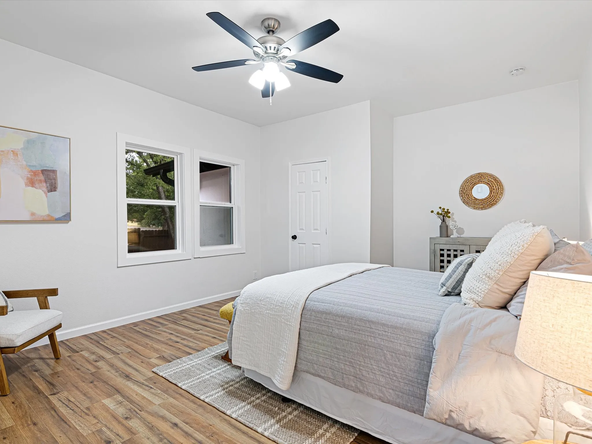 Primary bedroom is at the back of the front hall featuring LVP flooring, fresh paint, ceiling fan, ensuite full bathroom, etc.