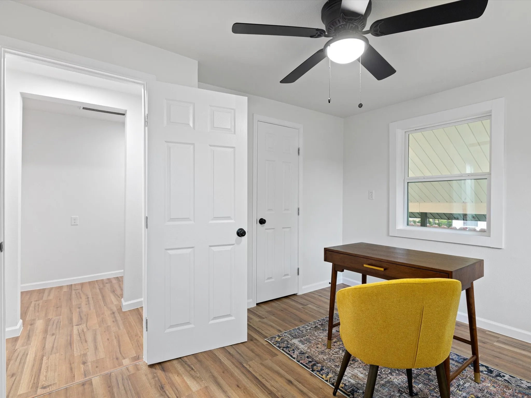 4th room is off the back hall off the back of the kitchen too