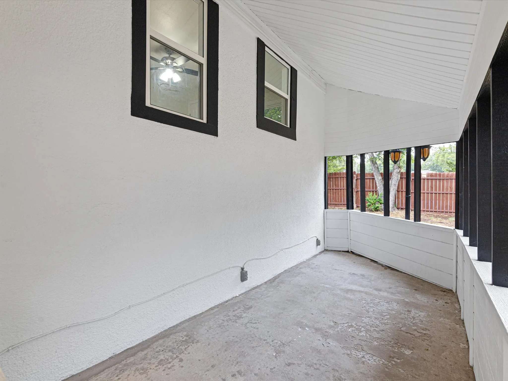 Back patio is spacious enough to fit lots of furniture in multiple places.